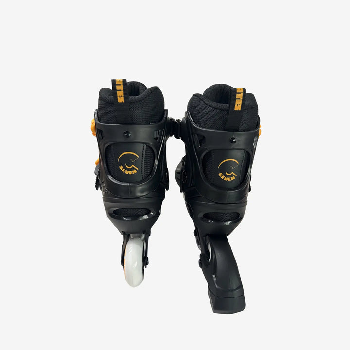 Black inline skates with white wheels on a white background