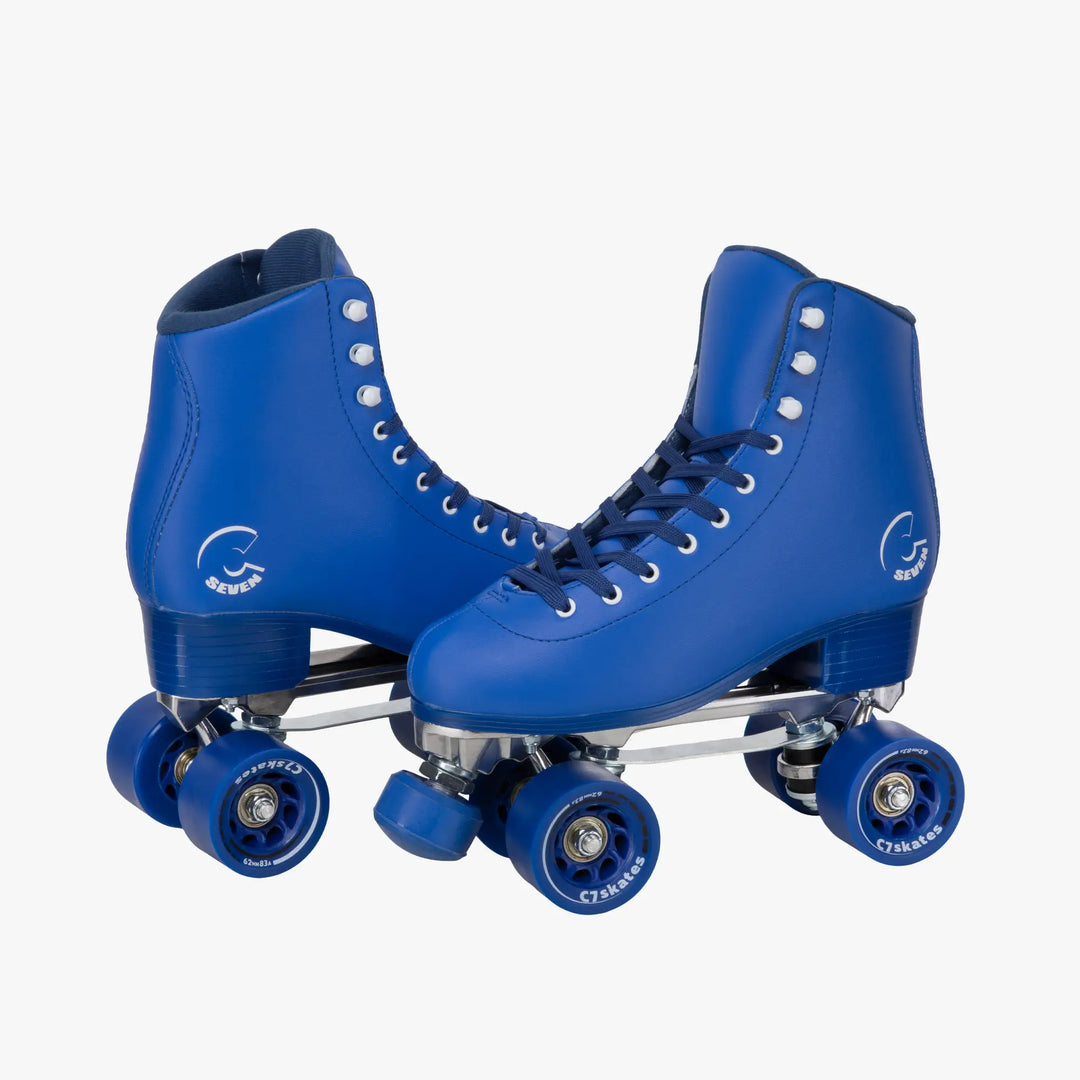 Pair of blue roller skates on a white background