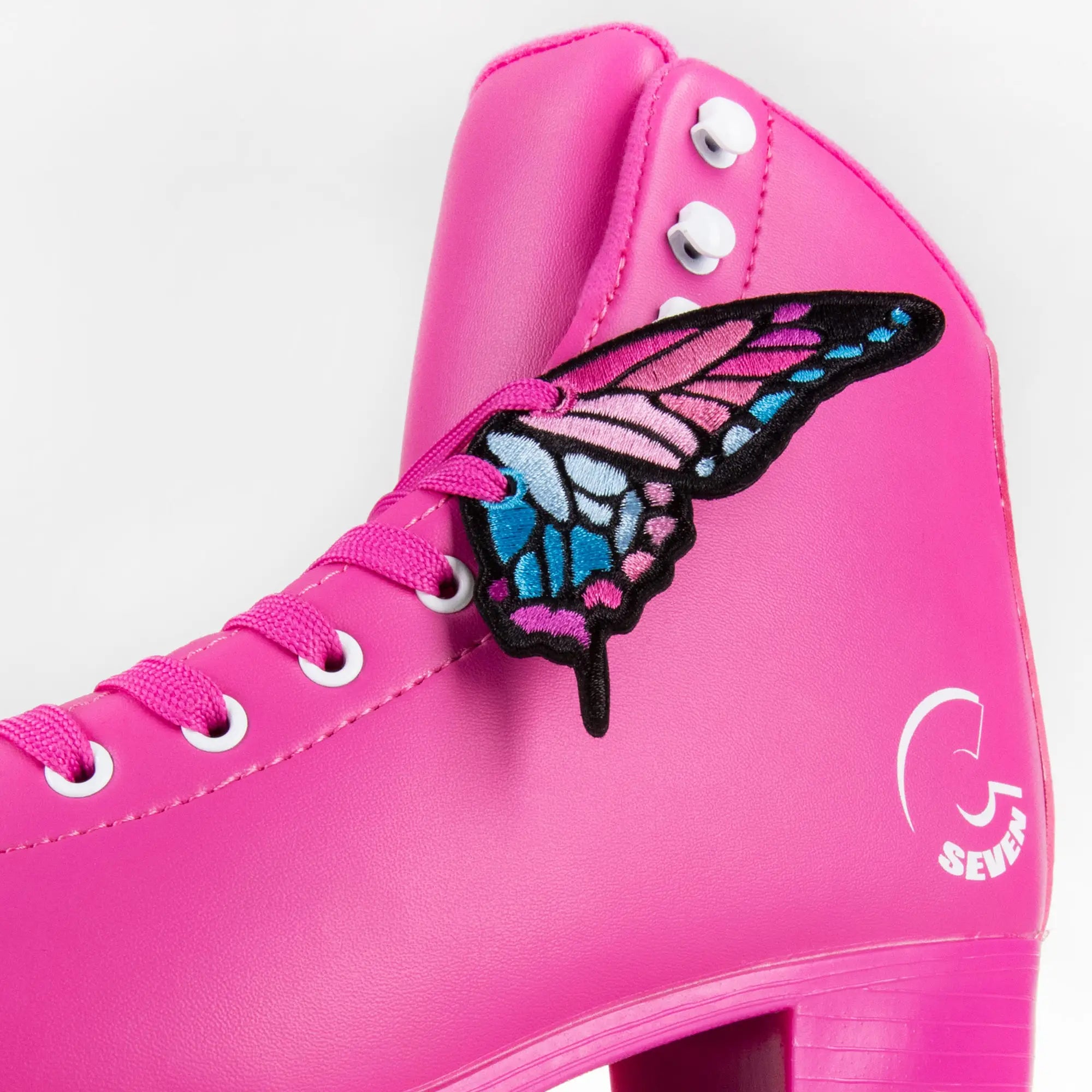 Pink Sunset Butterfly Wing Charms on a Pink roller skate