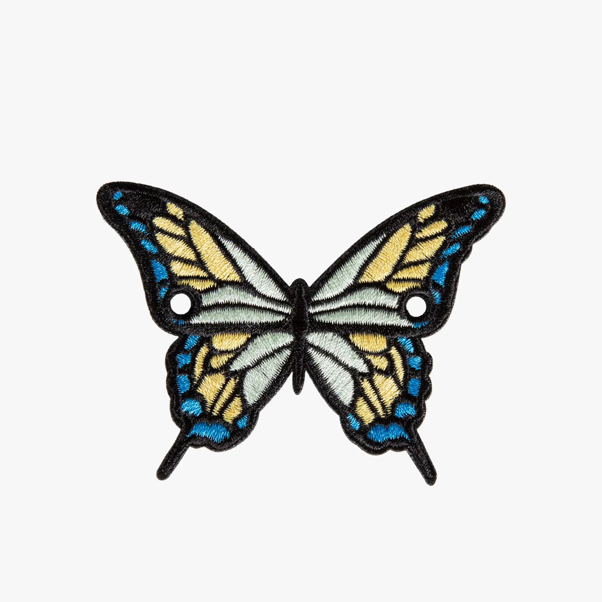 Butterfly-shaped charm with blue and yellow wings on a white background