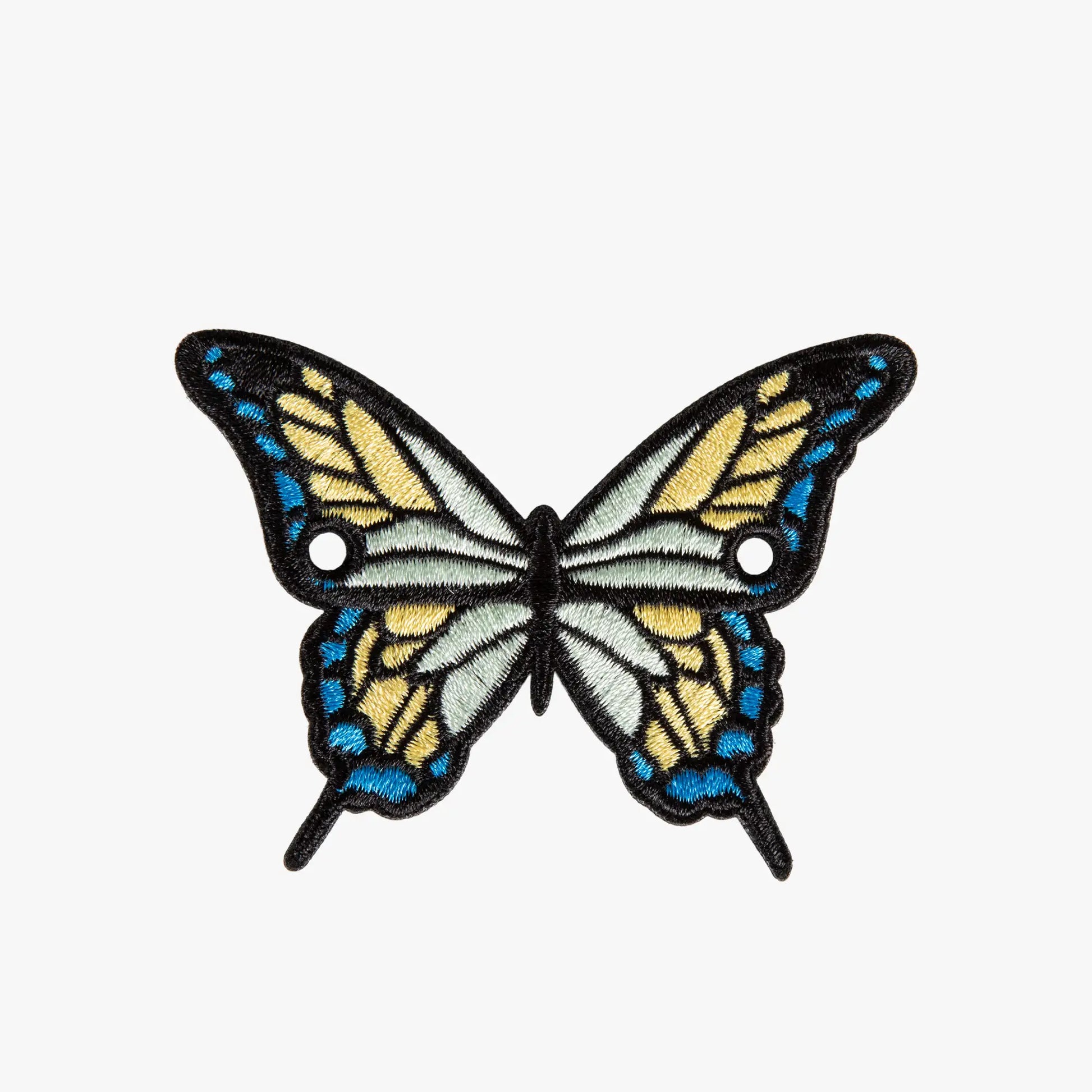 Butterfly-shaped charm with blue and yellow wings on a white background