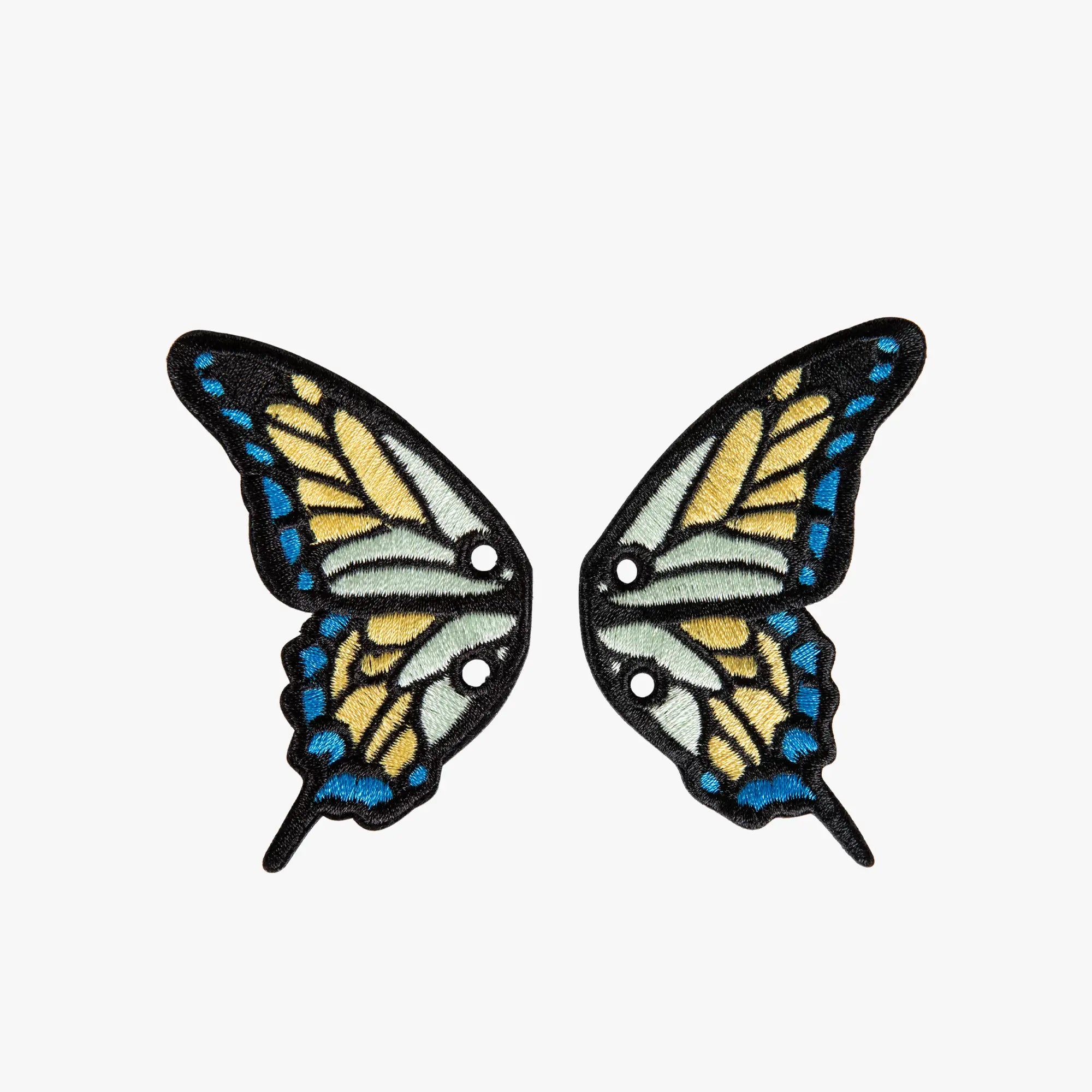 Pair of butterfly wing charms on a white background