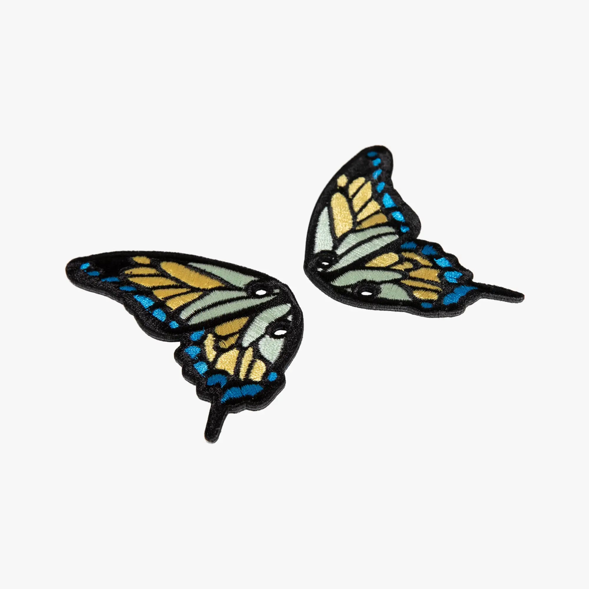 Butterfly-shaped charms on a white background