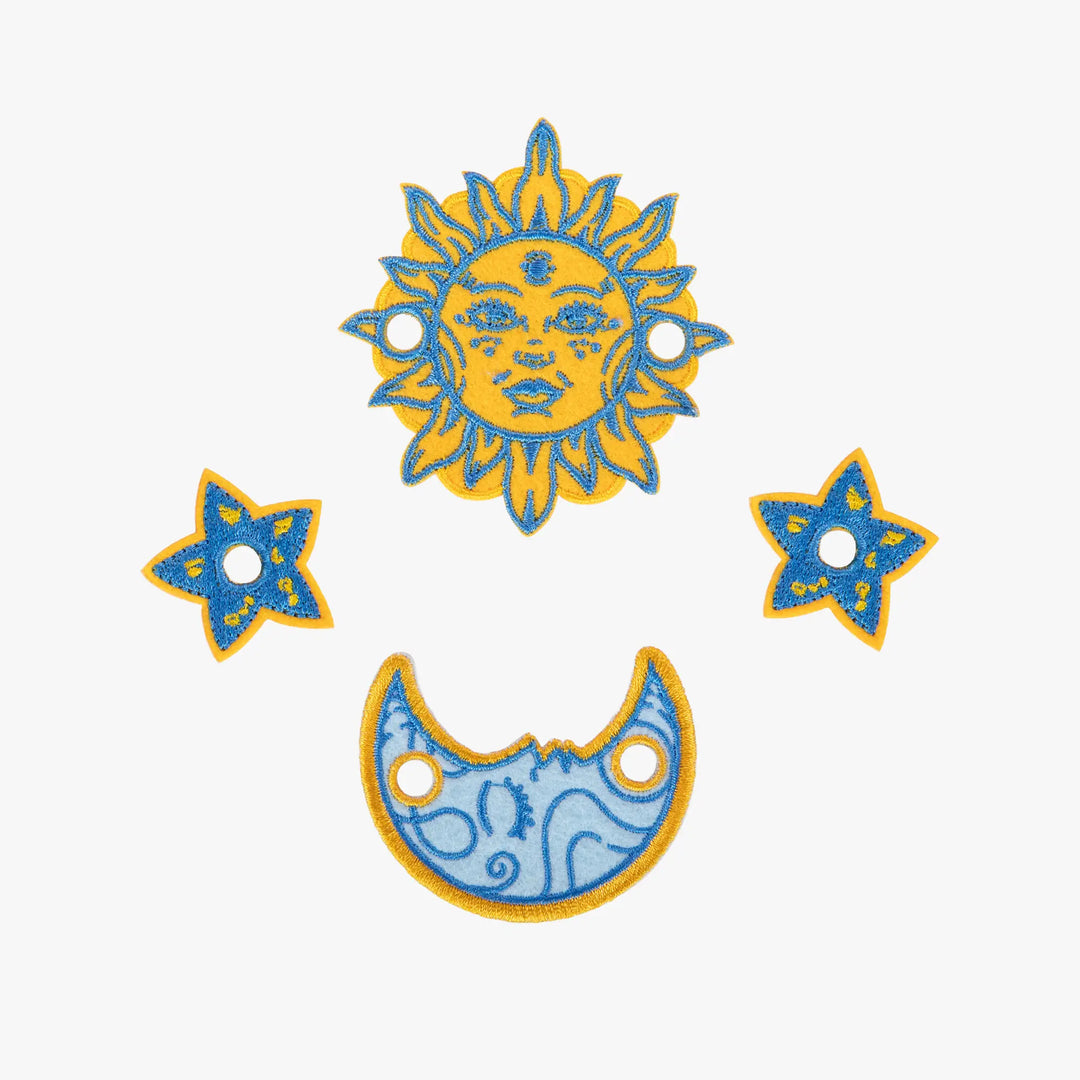 Decorative sun, moon, and star shapes on a white background
