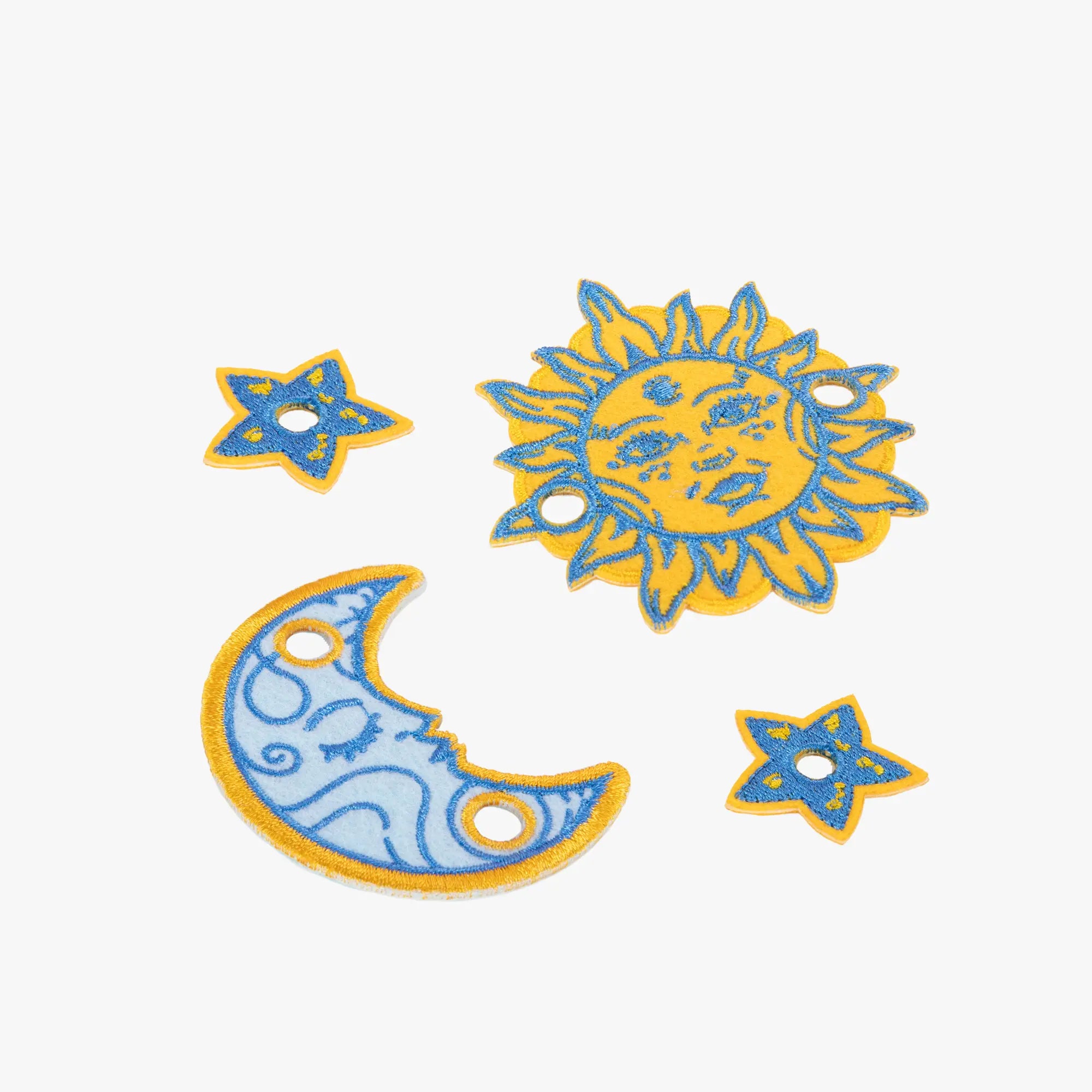 Decorative sun, moon, and star charm set