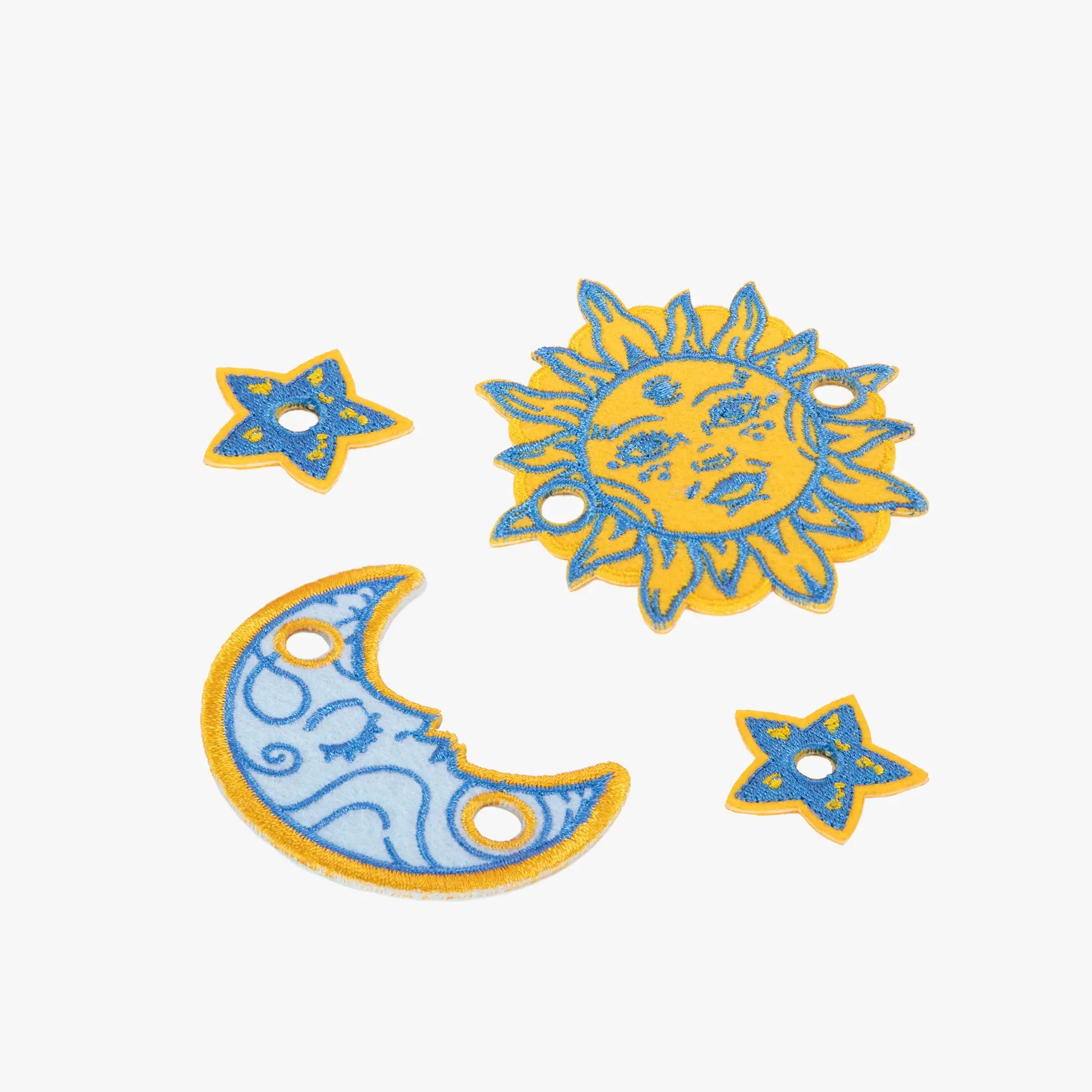 Decorative sun, moon, and star charm set