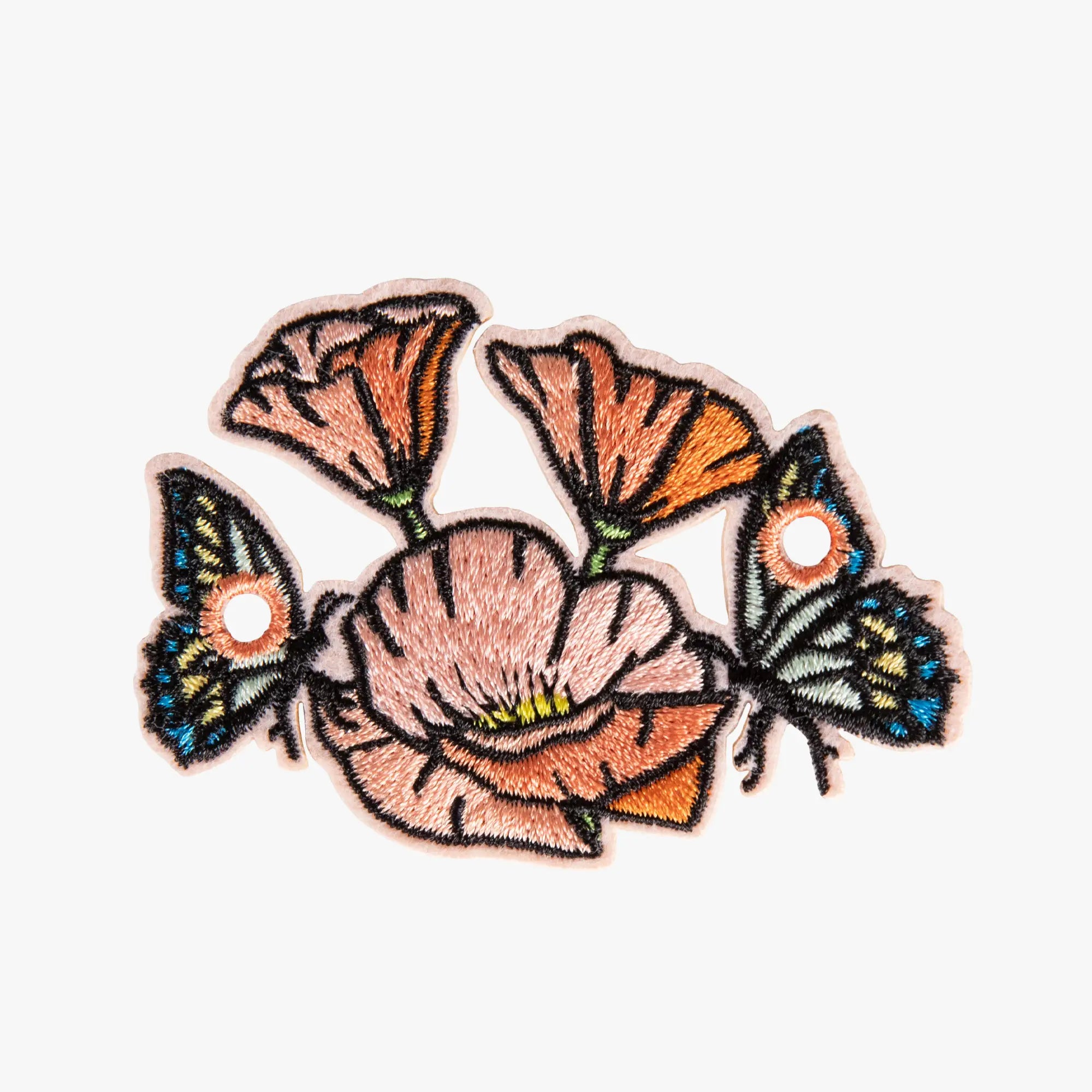Embroidered charm with flowers and butterflies on a white background