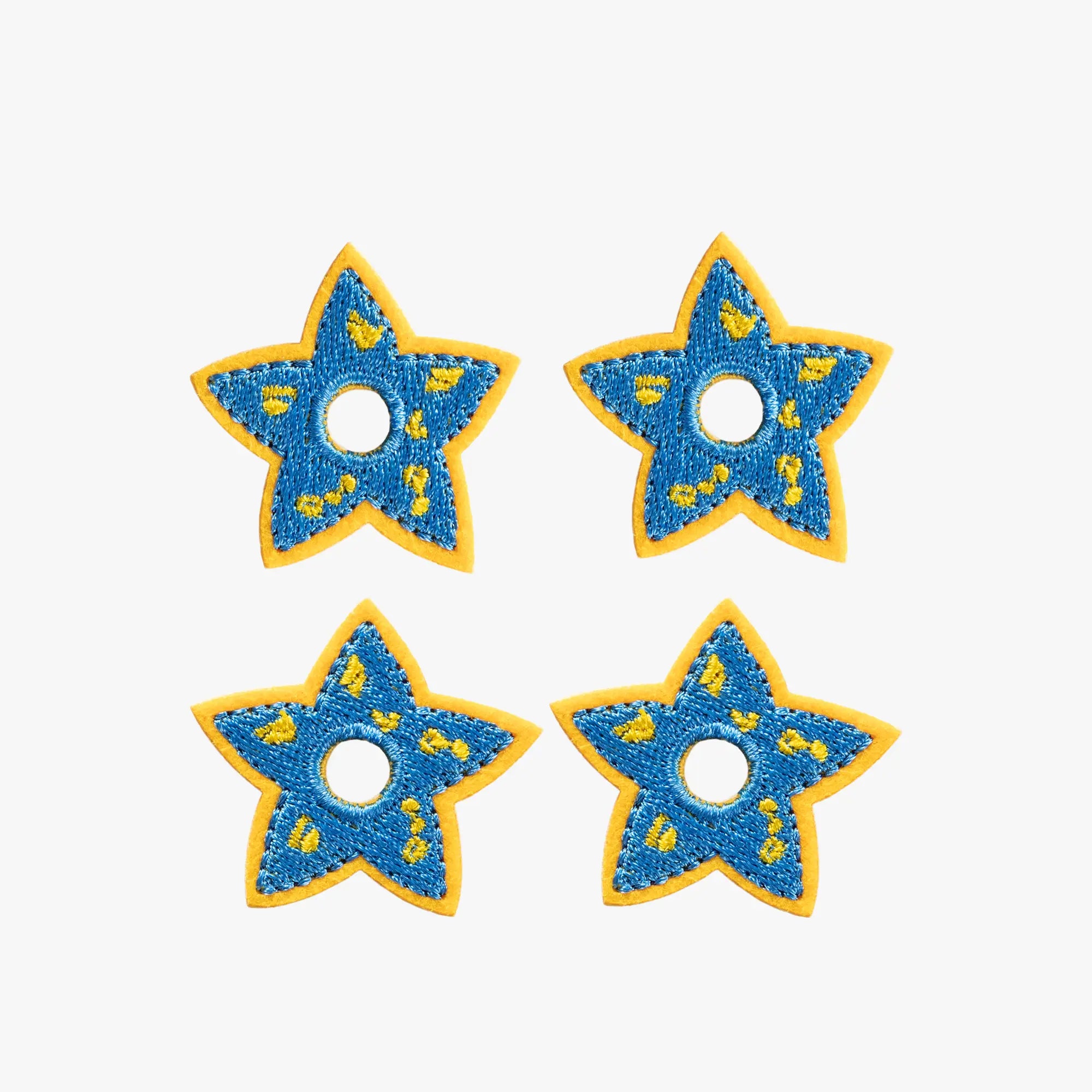 Four blue star-shaped charms. Space Blue Celestial Star Mini Charms