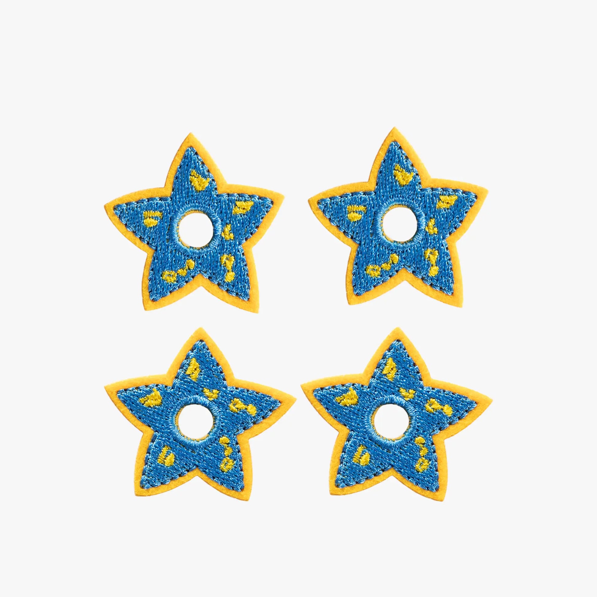 Four blue star-shaped charms. Space Blue Celestial Star Mini Charms