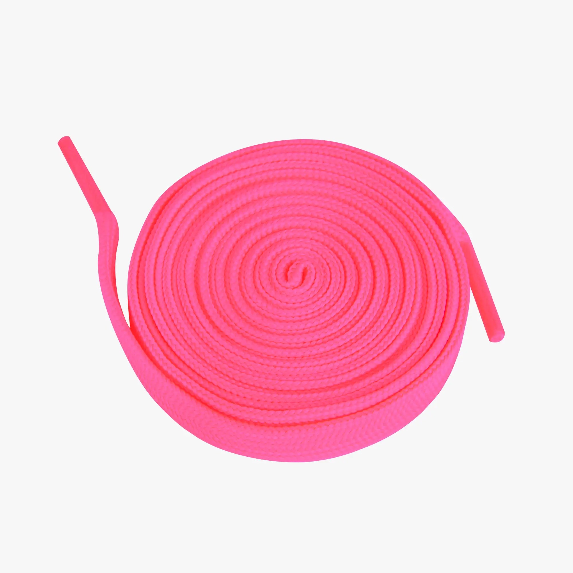 Pink shoelaces coiled on a white background