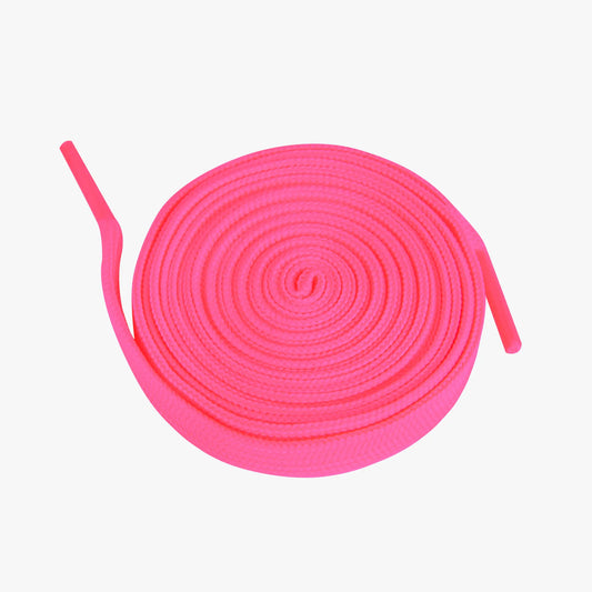 Pink shoelaces coiled on a white background