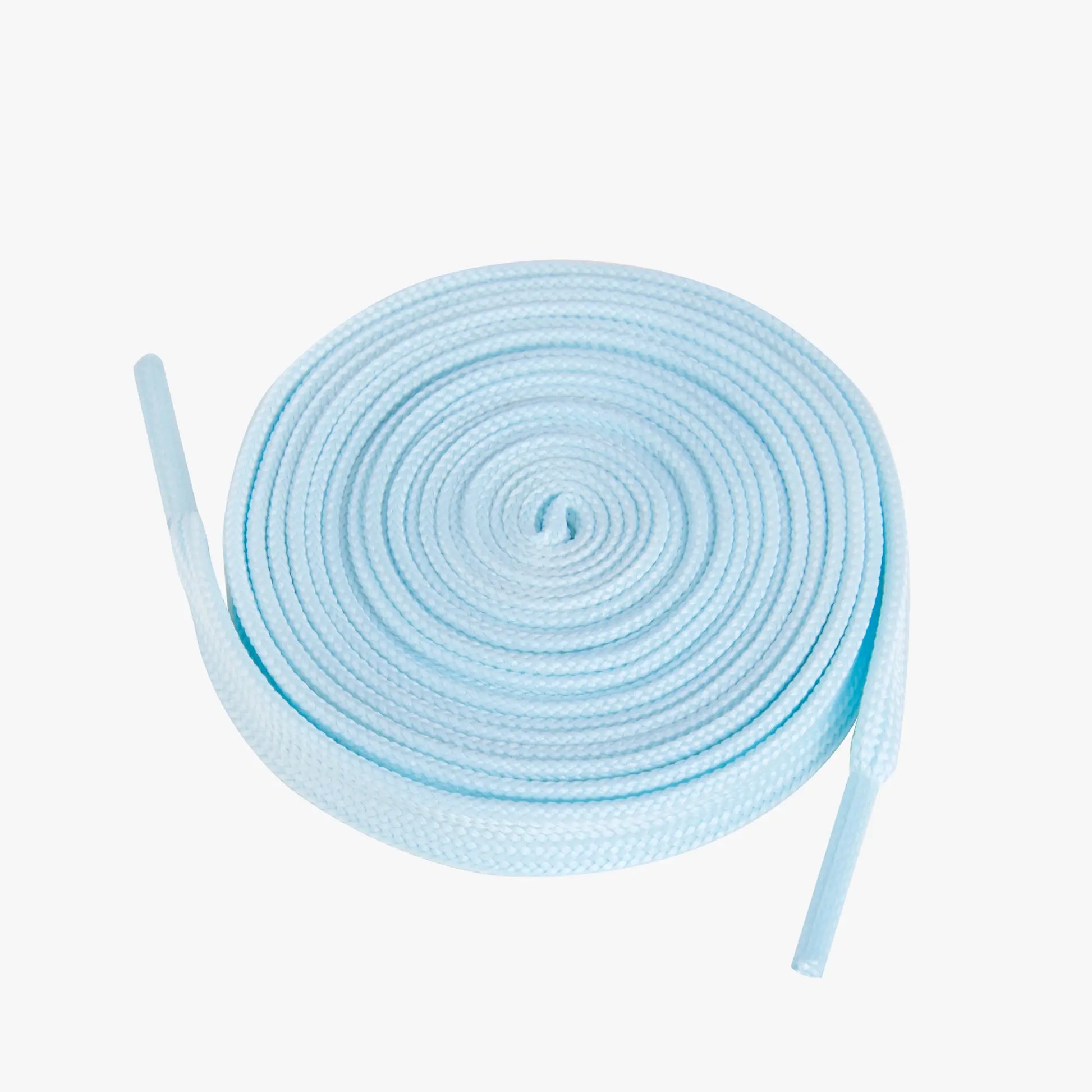 Light blue shoelaces coiled on a white background