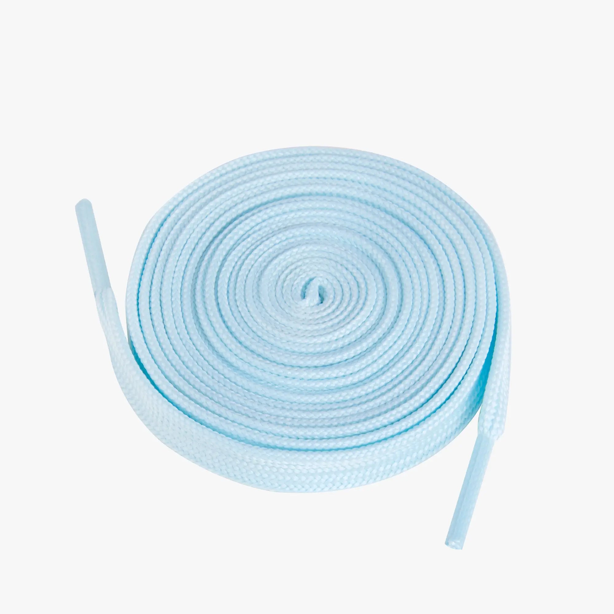 Light blue shoelaces coiled on a white background