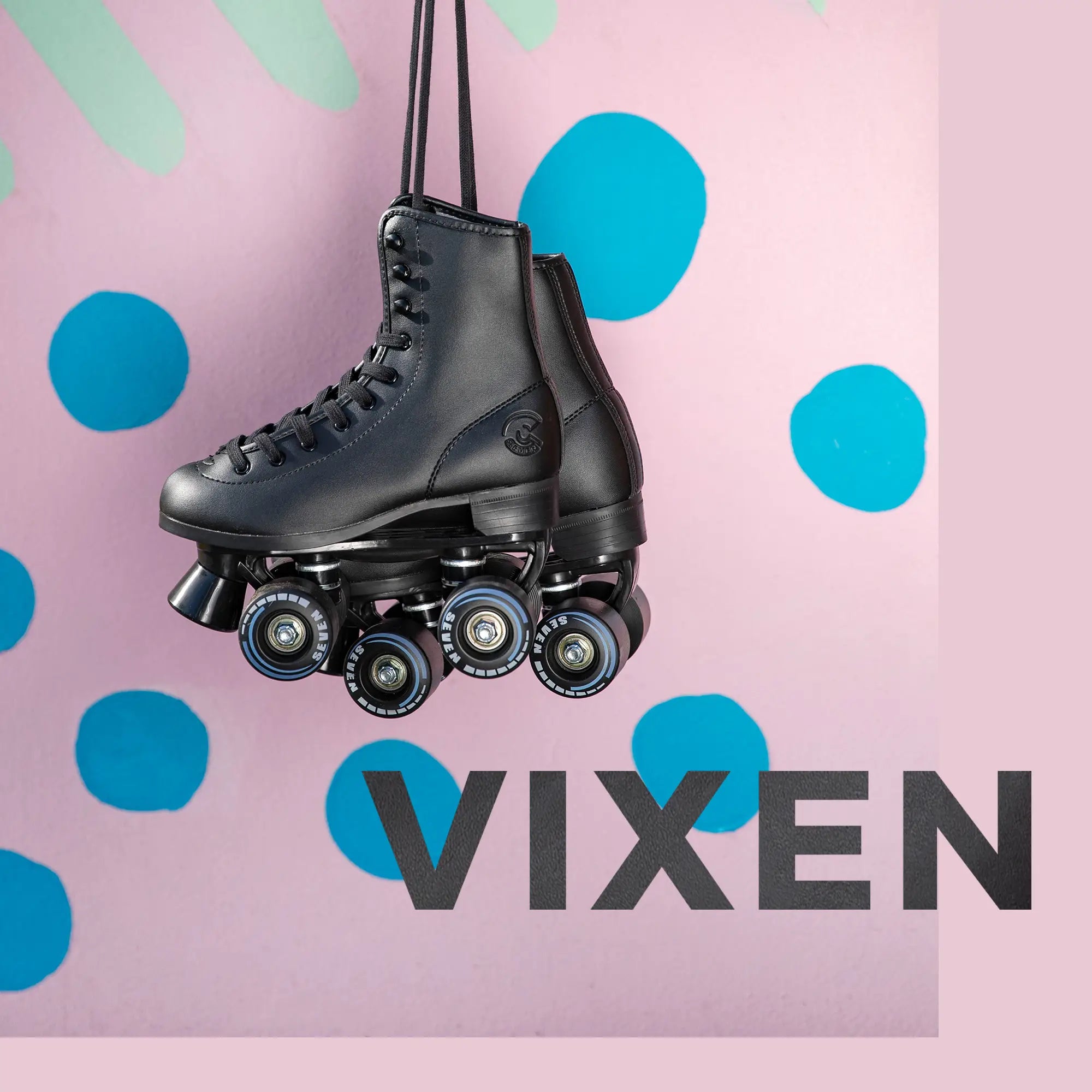 Black roller skates hanging against a pink background with blue polka dots and 'VIXEN' branding.