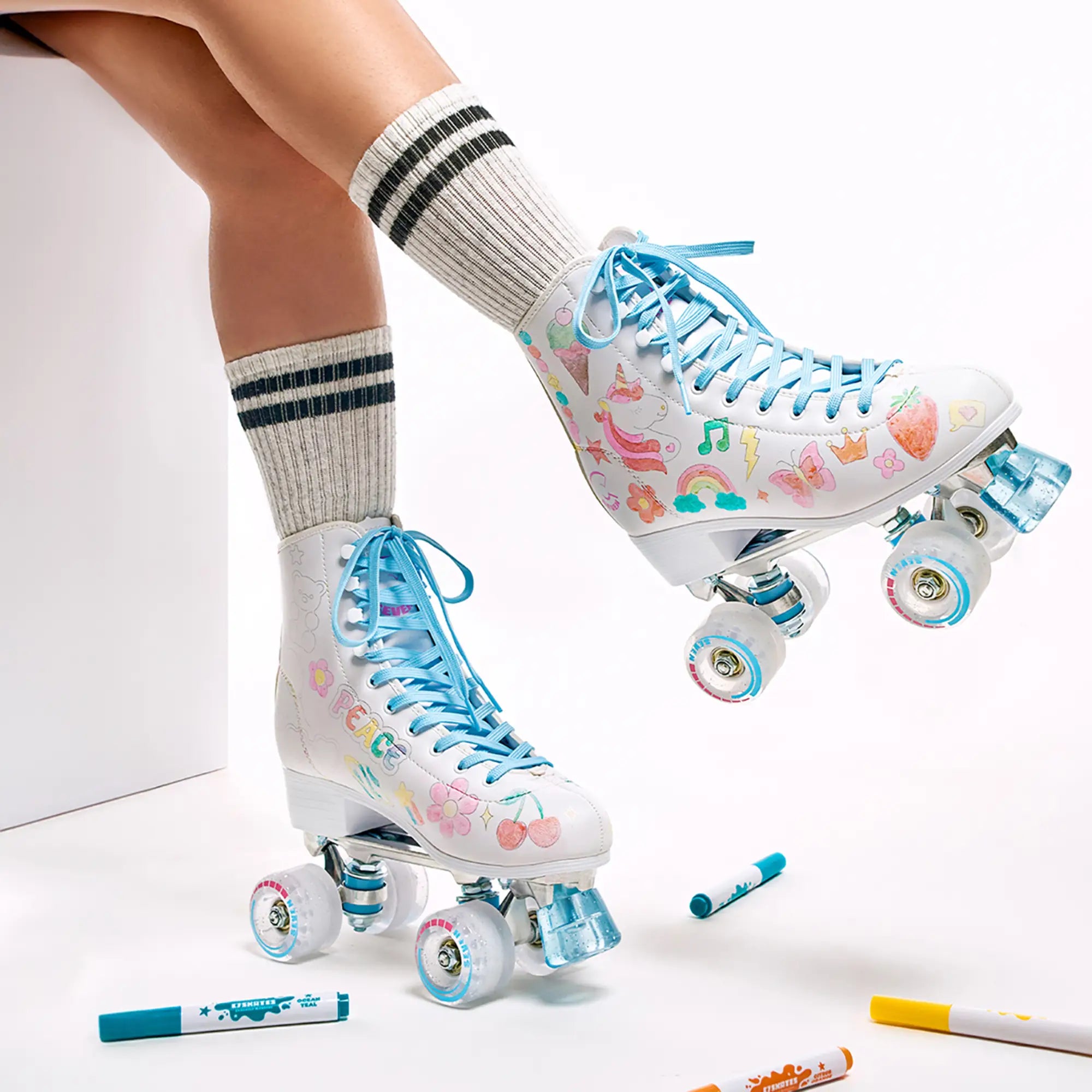 Roller skates with colorful designs on a white background