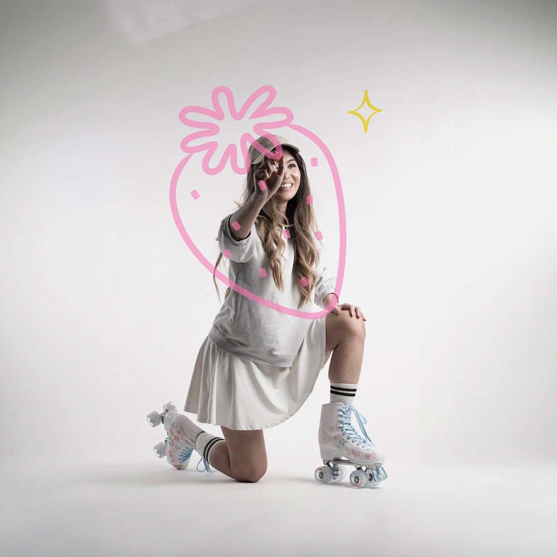Woman in a white dress with roller skates on a plain background