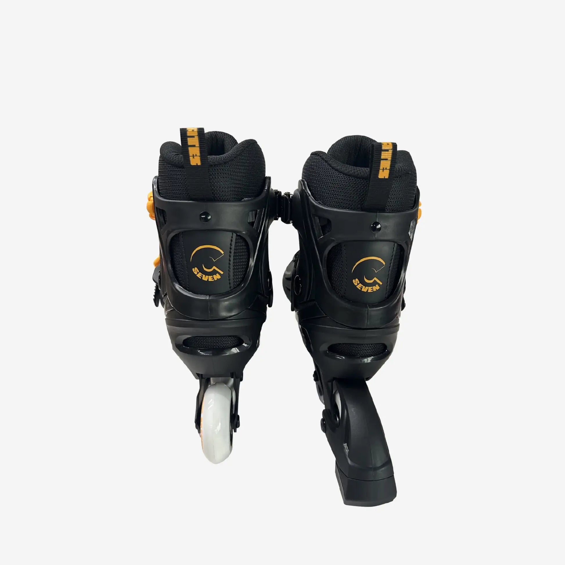 Black inline skates with white wheels on a white background