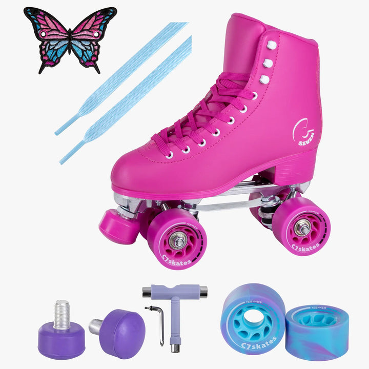 Pink roller skates with accessories on a white background