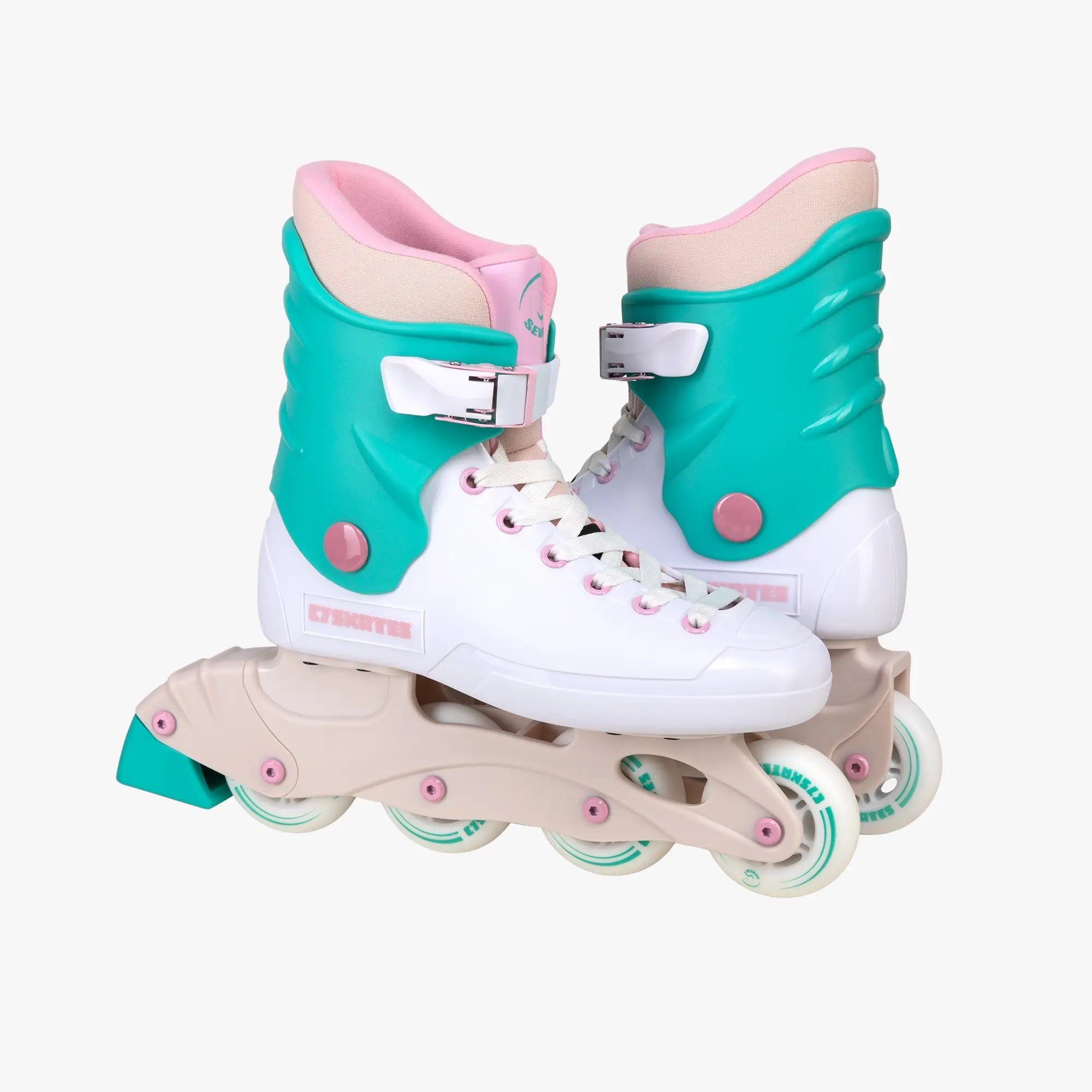 Pair of turquoise and pink roller skates on a white background