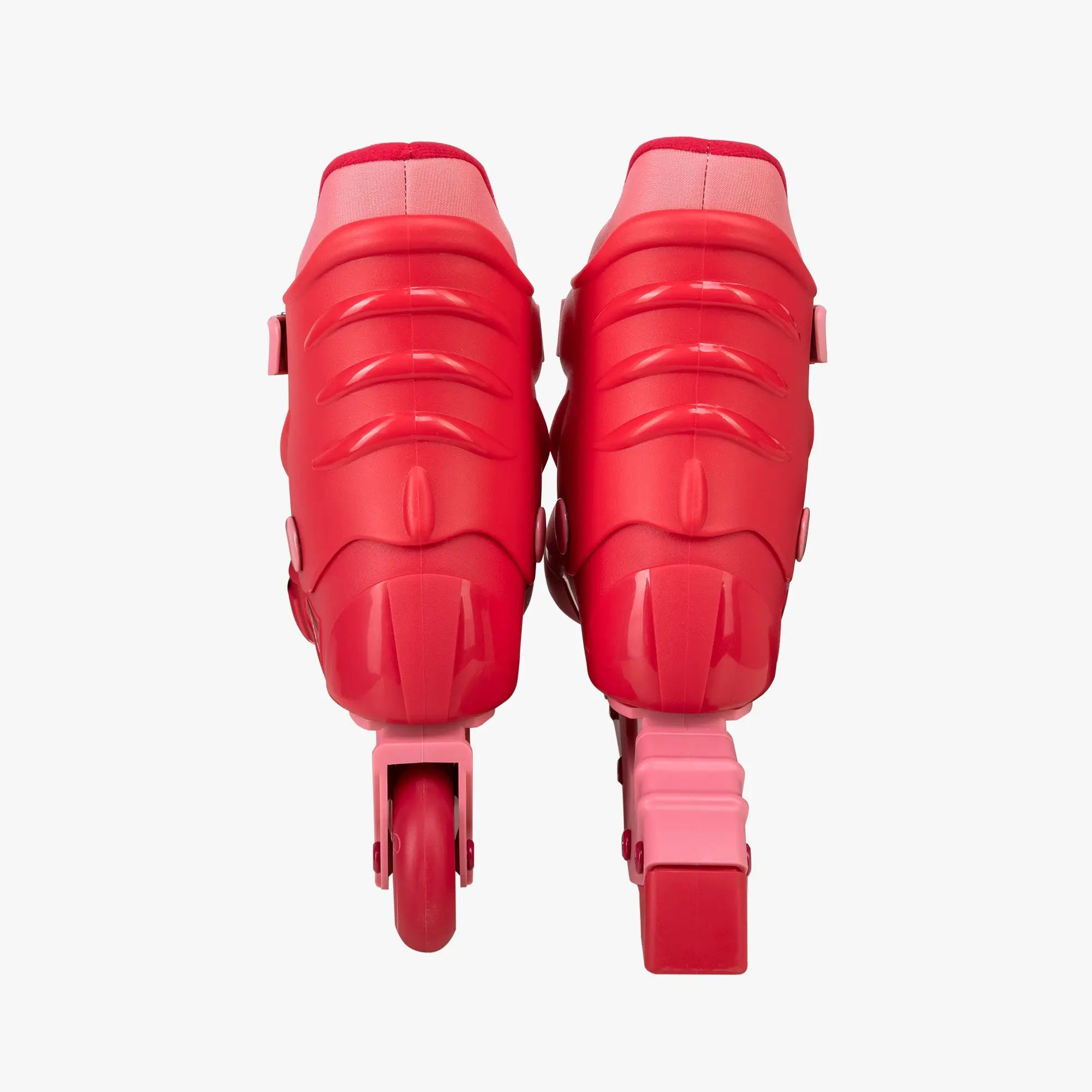 Pair of red roller skates on a white background