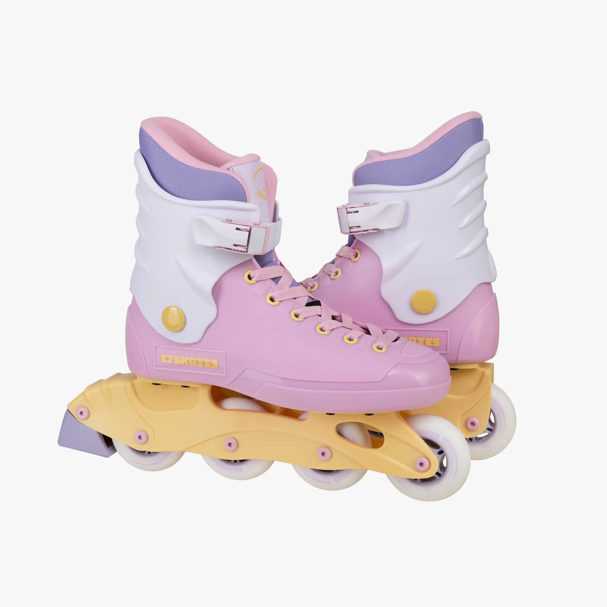 Pink and purple inline skates with yellow axles on a white background