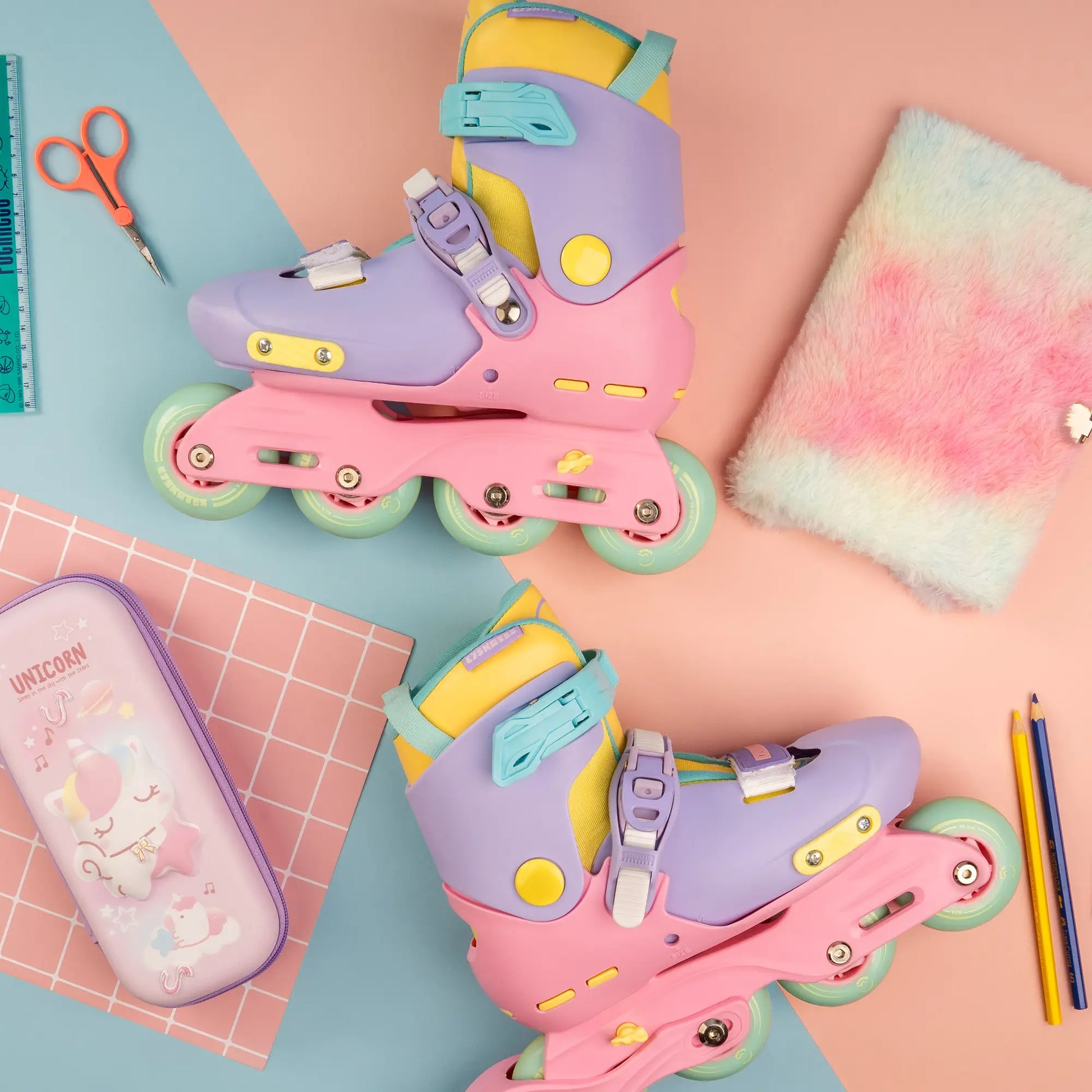 Colorful inline skates on a colorful background with stationery items.