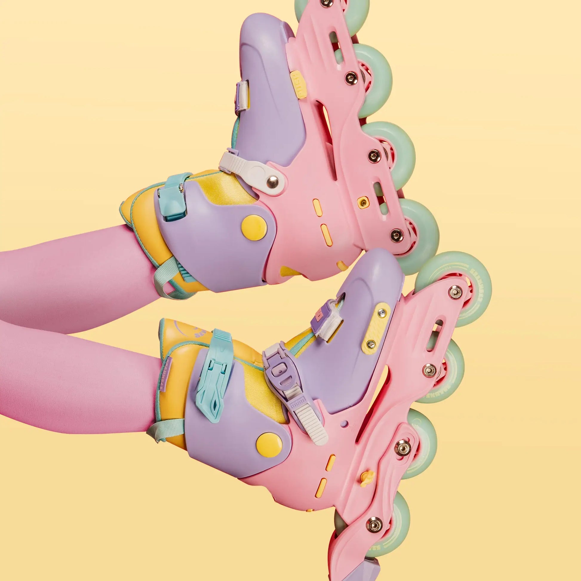 Colorful roller skates on a yellow background