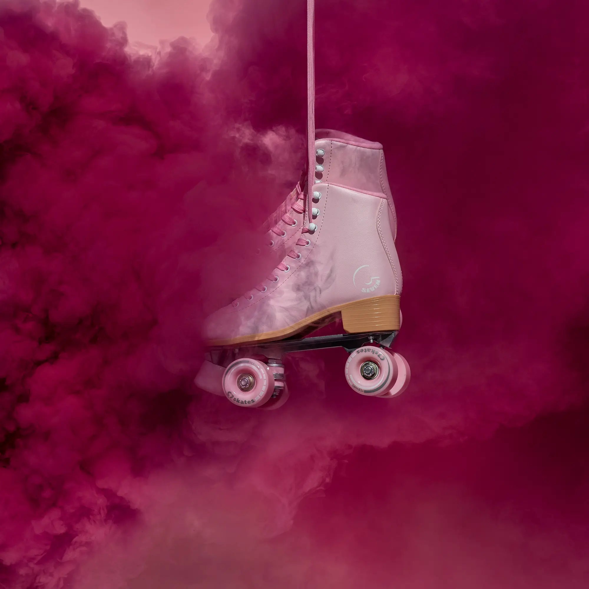 pink roller skate with pink smoke effect on a pink background