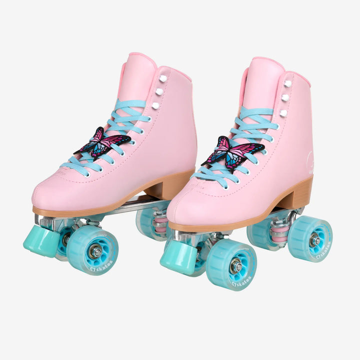 Pink roller skates with blue laces and turquoise wheels on a white background