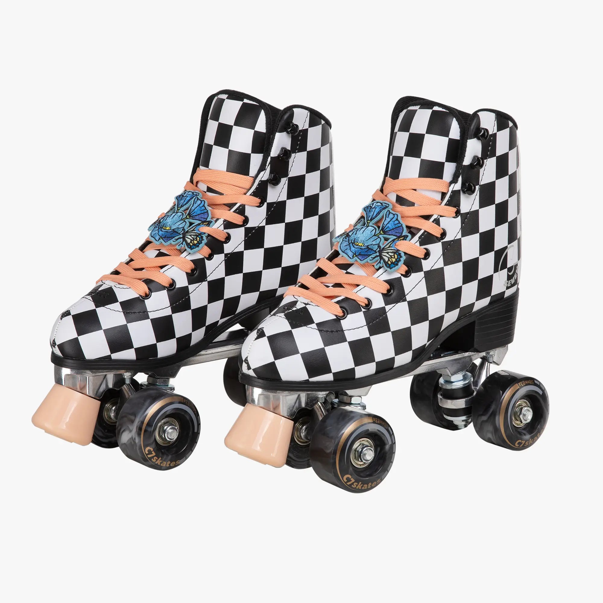 Pair of checkered roller skates with floral designs on laces against a white background