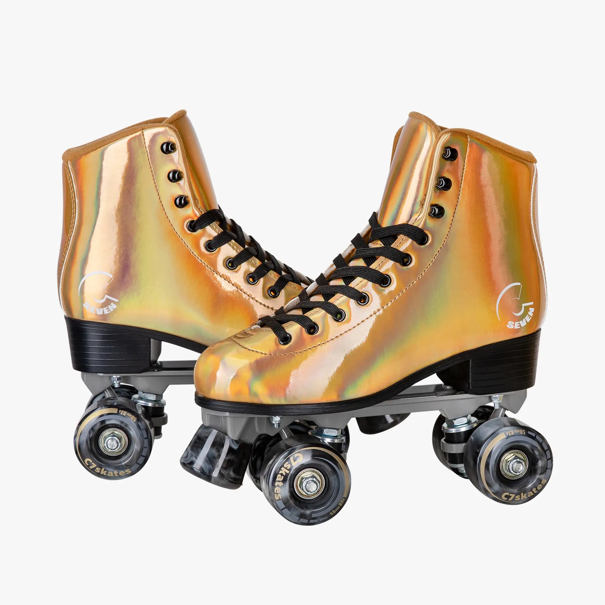 Pair of metallic gold roller skates on a white background