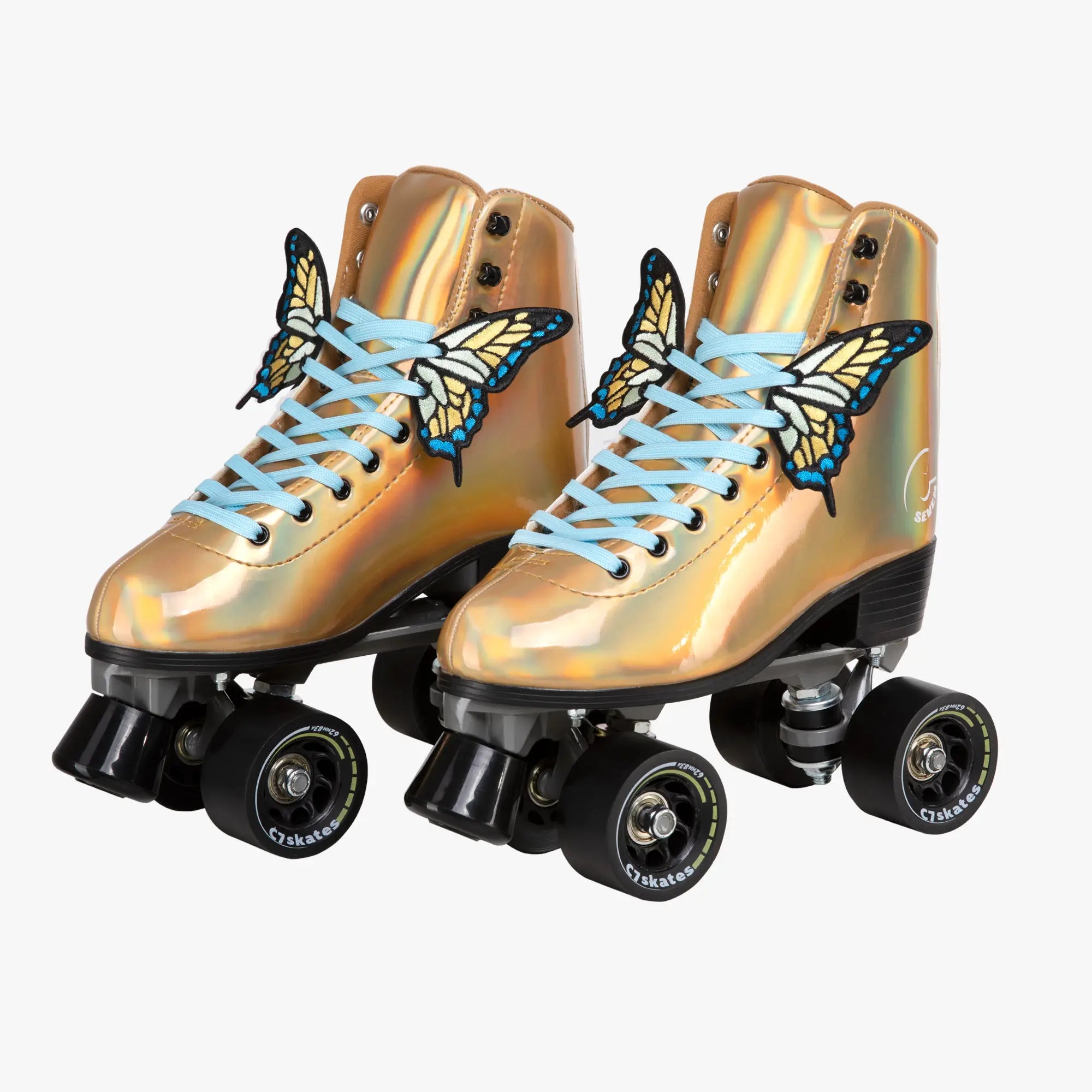 Gold metallic roller skates with butterfly designs on a white background