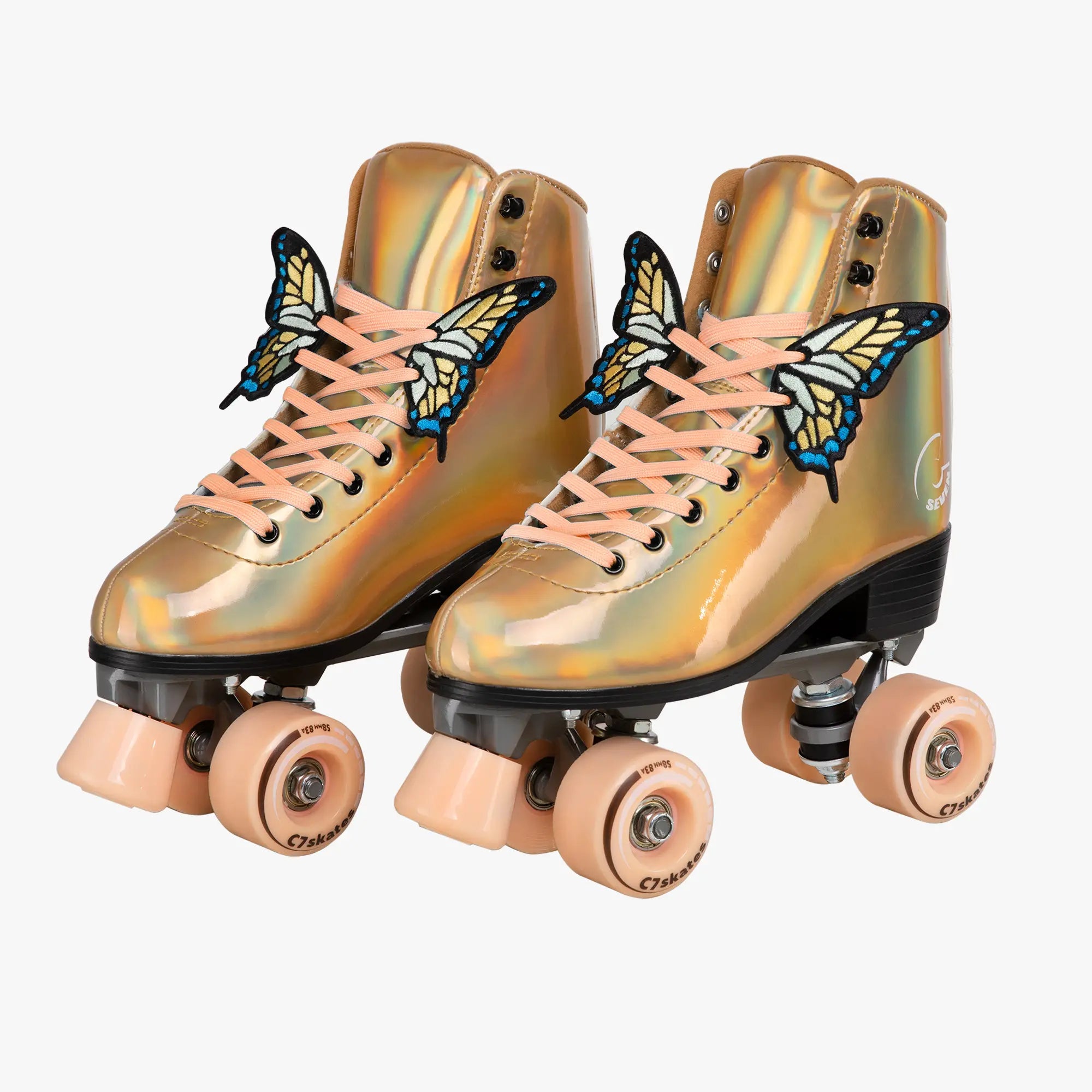 Gold metallic roller skates with butterfly decorations on a white background