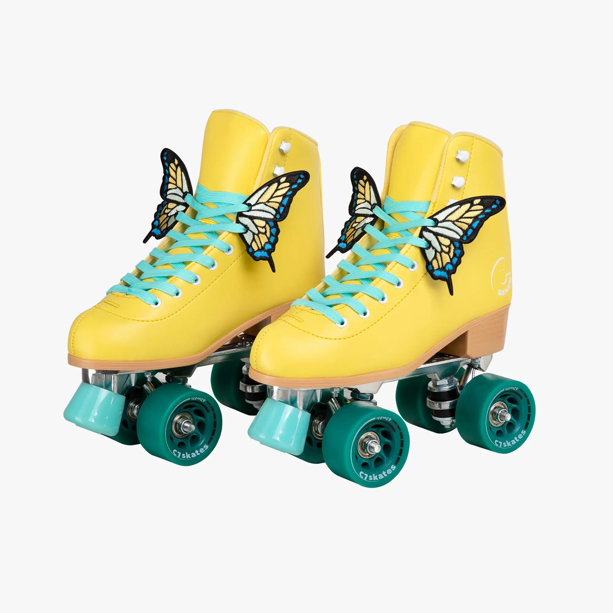 Yellow roller skates with butterfly designs and turquoise laces on a white background