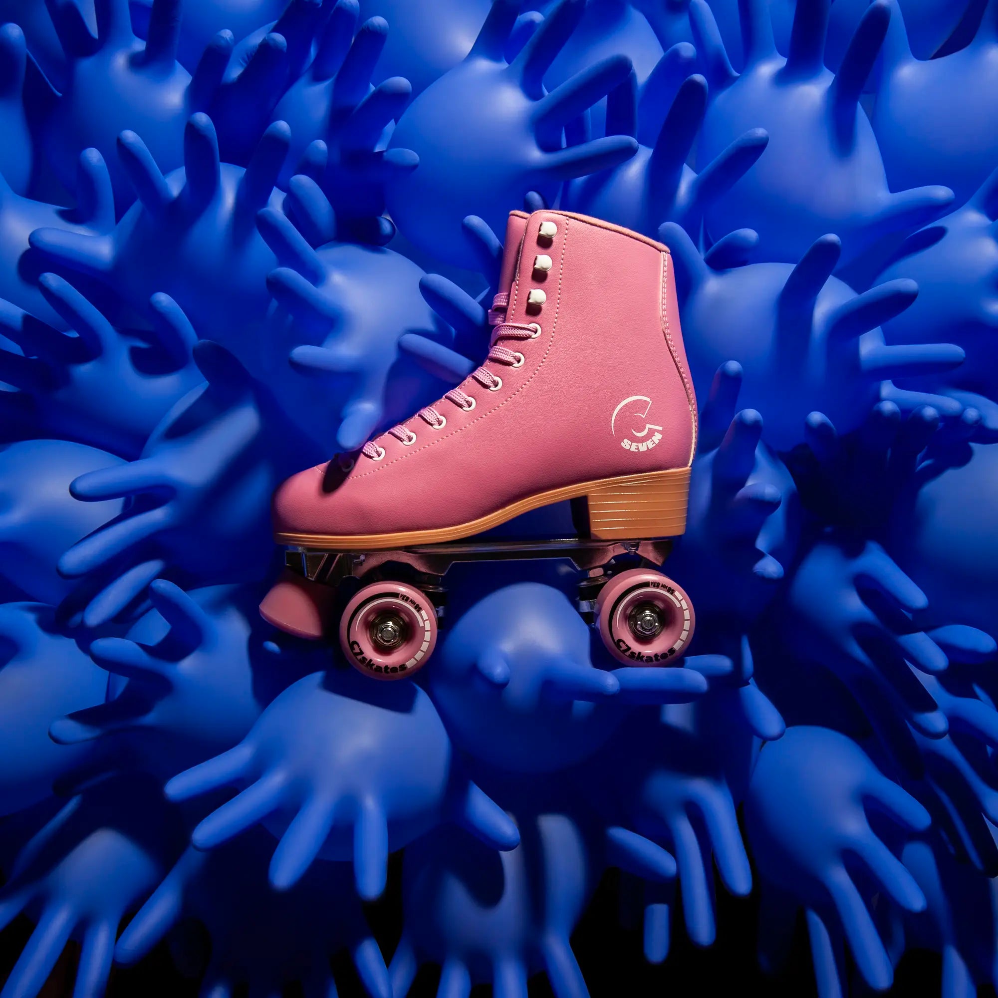 Pink roller skate surrounded by blue textured hand globes