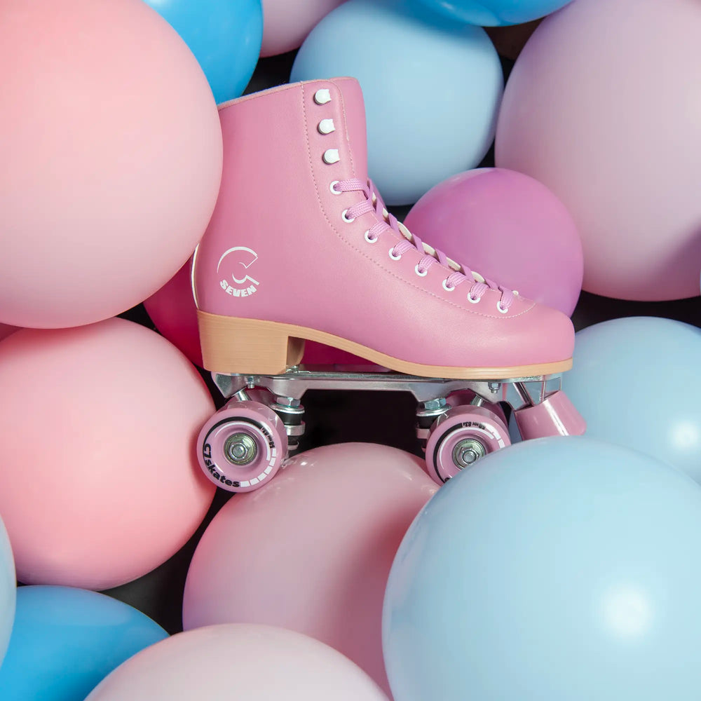 Pink roller skate among colorful balloons