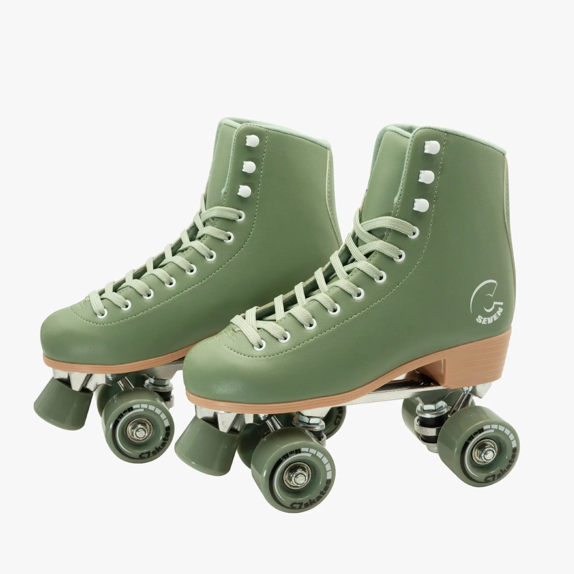 Pair of green roller skates with brown soles featuring the brand 'C7Skates' on a white background
