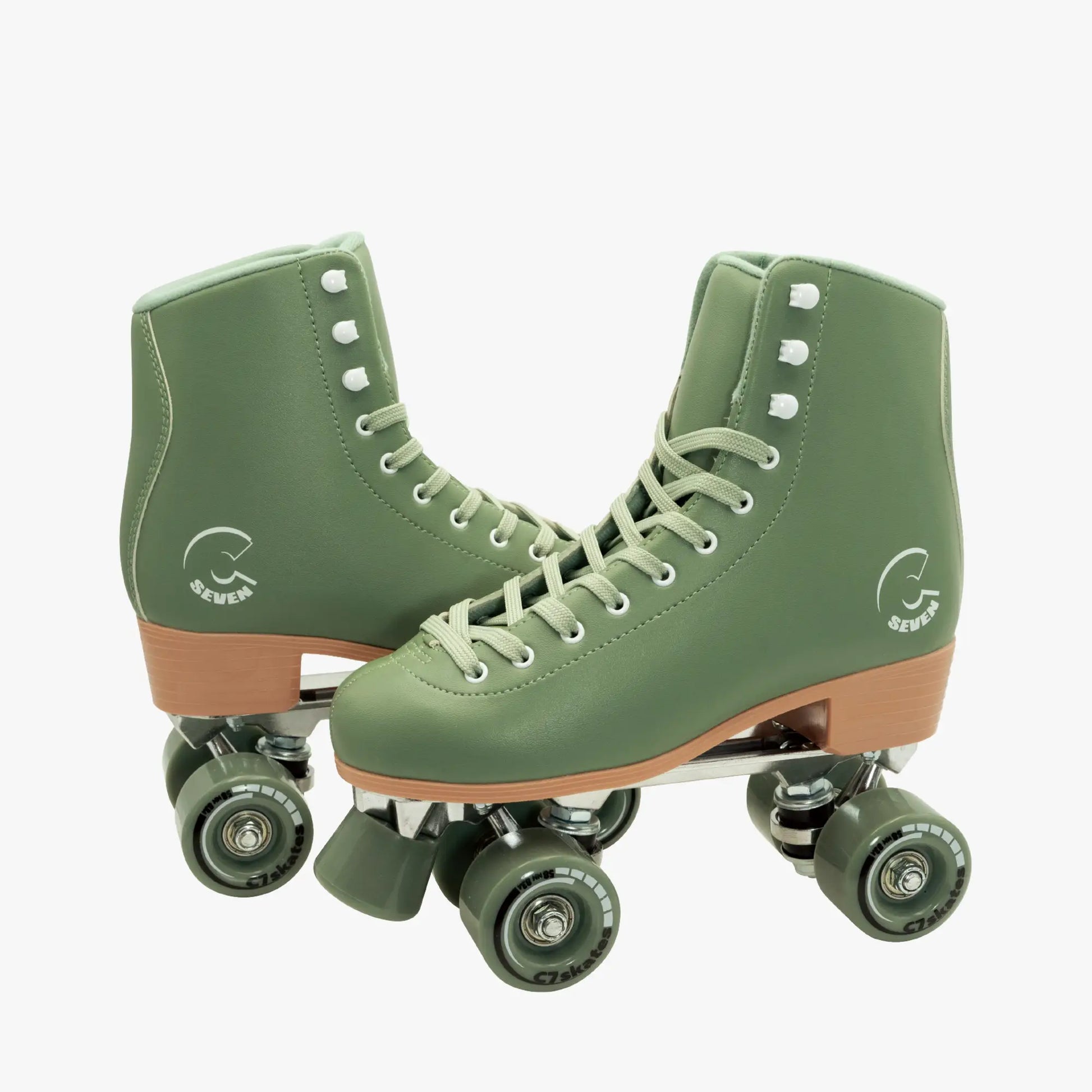 Green roller skates with brown accents featuring the brand 'C7Skates' on a white background