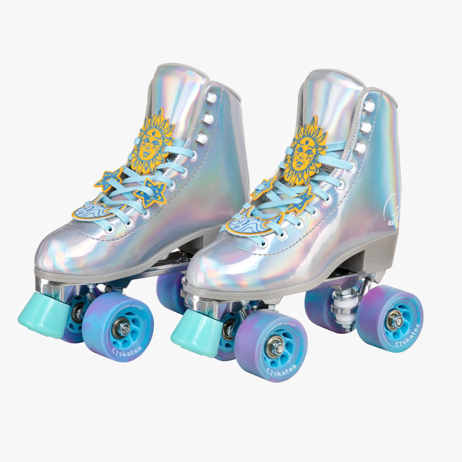 Pair of silver holographic roller skates with blue and purple wheels on a white background