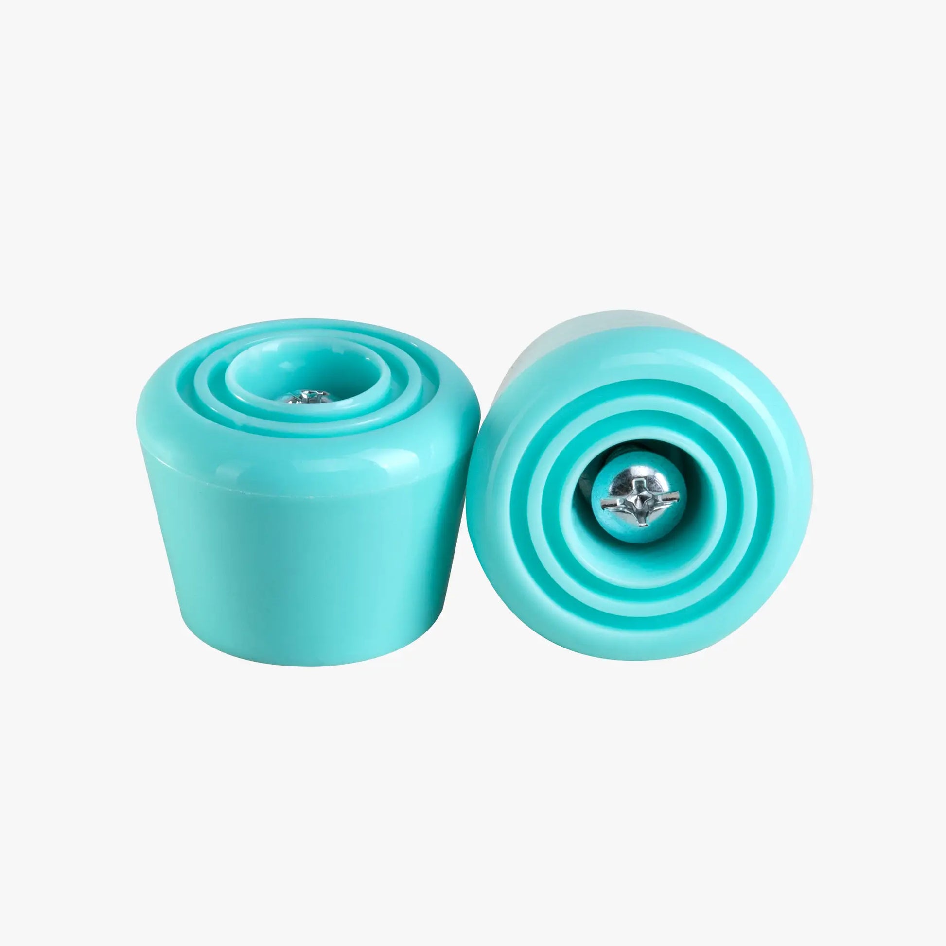 Two turquoise stoppers on a white background