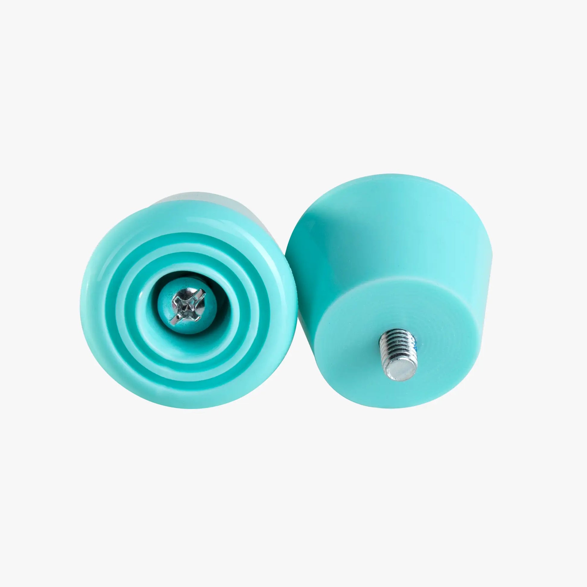 Two turquoise stoppers on a white background