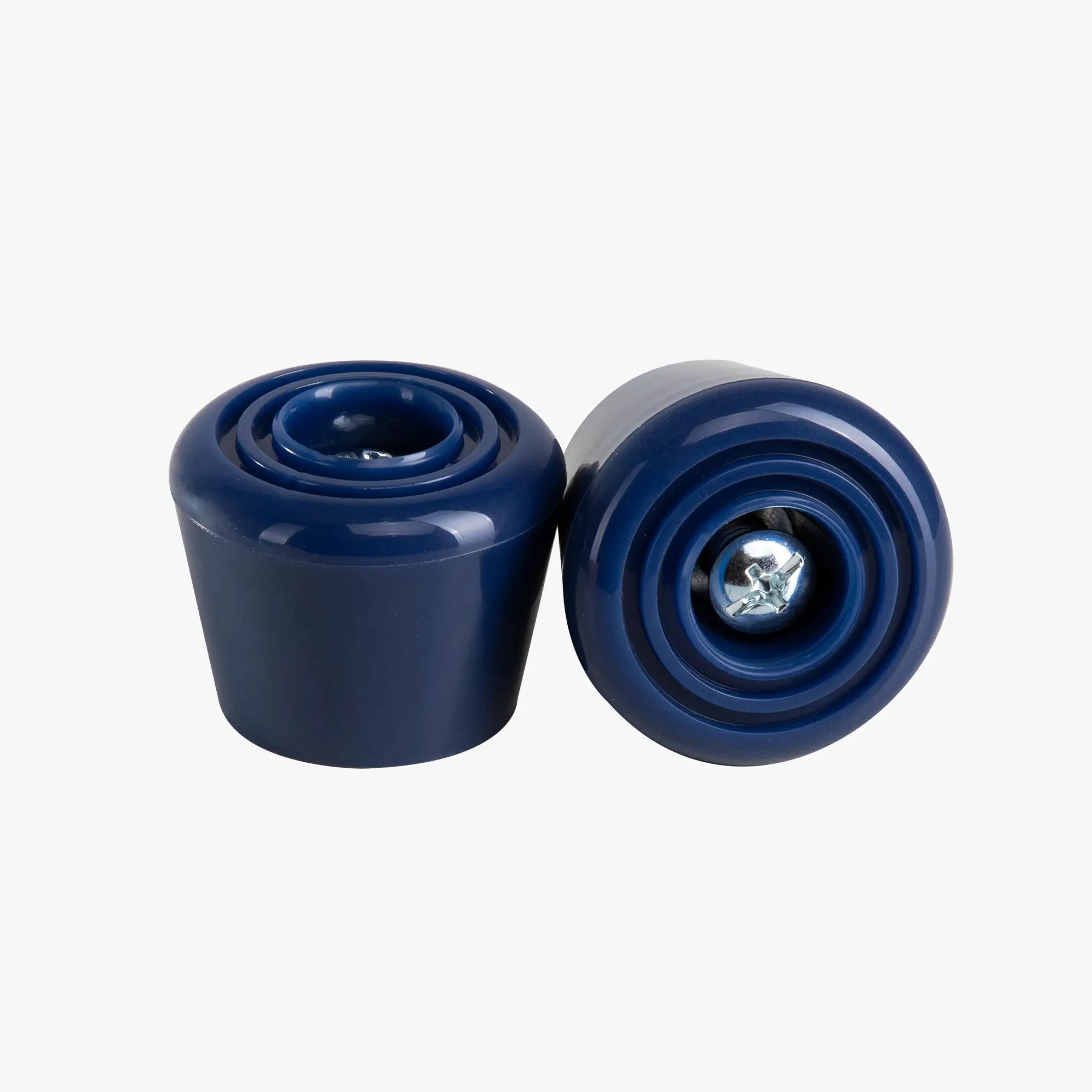 Two blue cylindrical stoppers on a white background