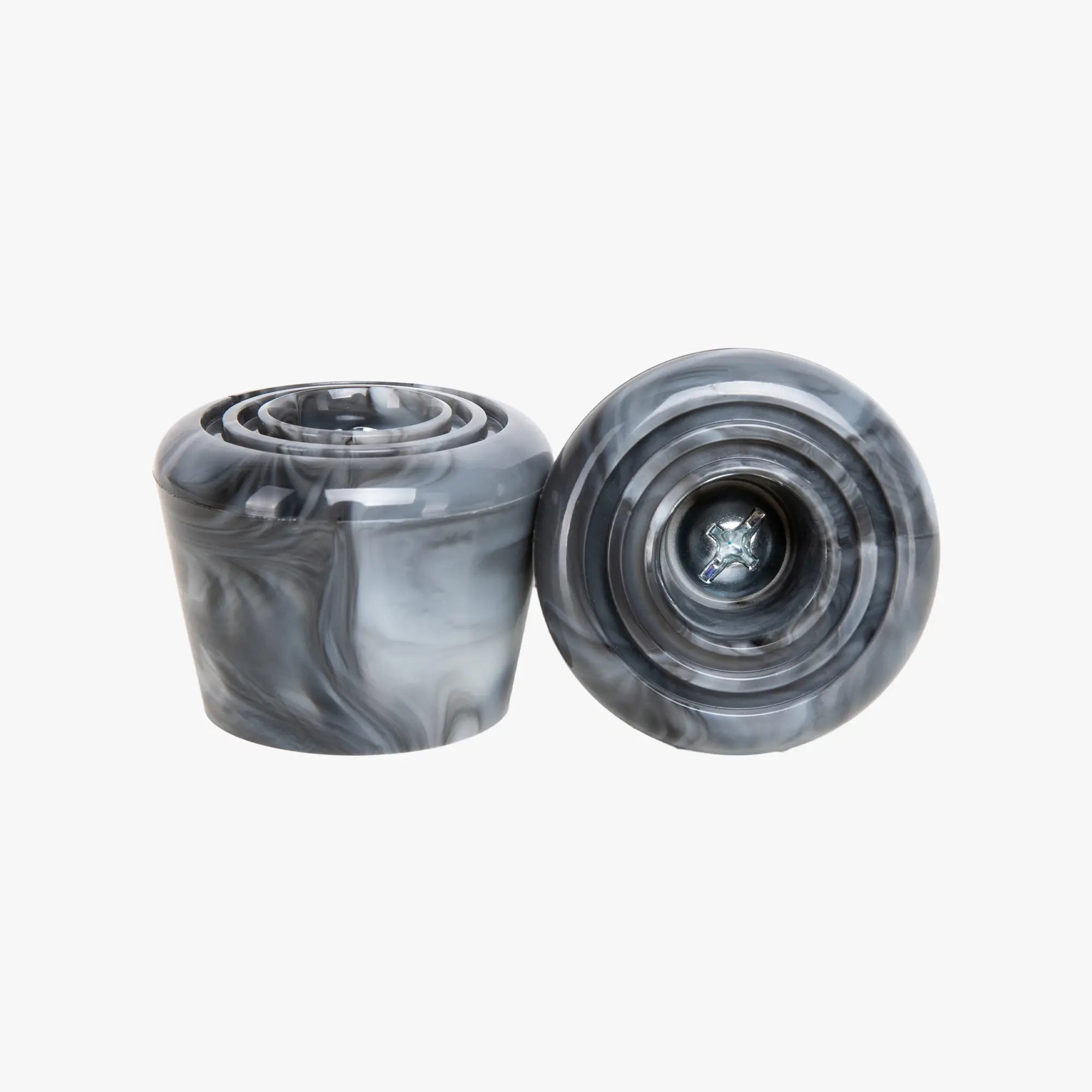 Two gray marbled stoppers on a white background