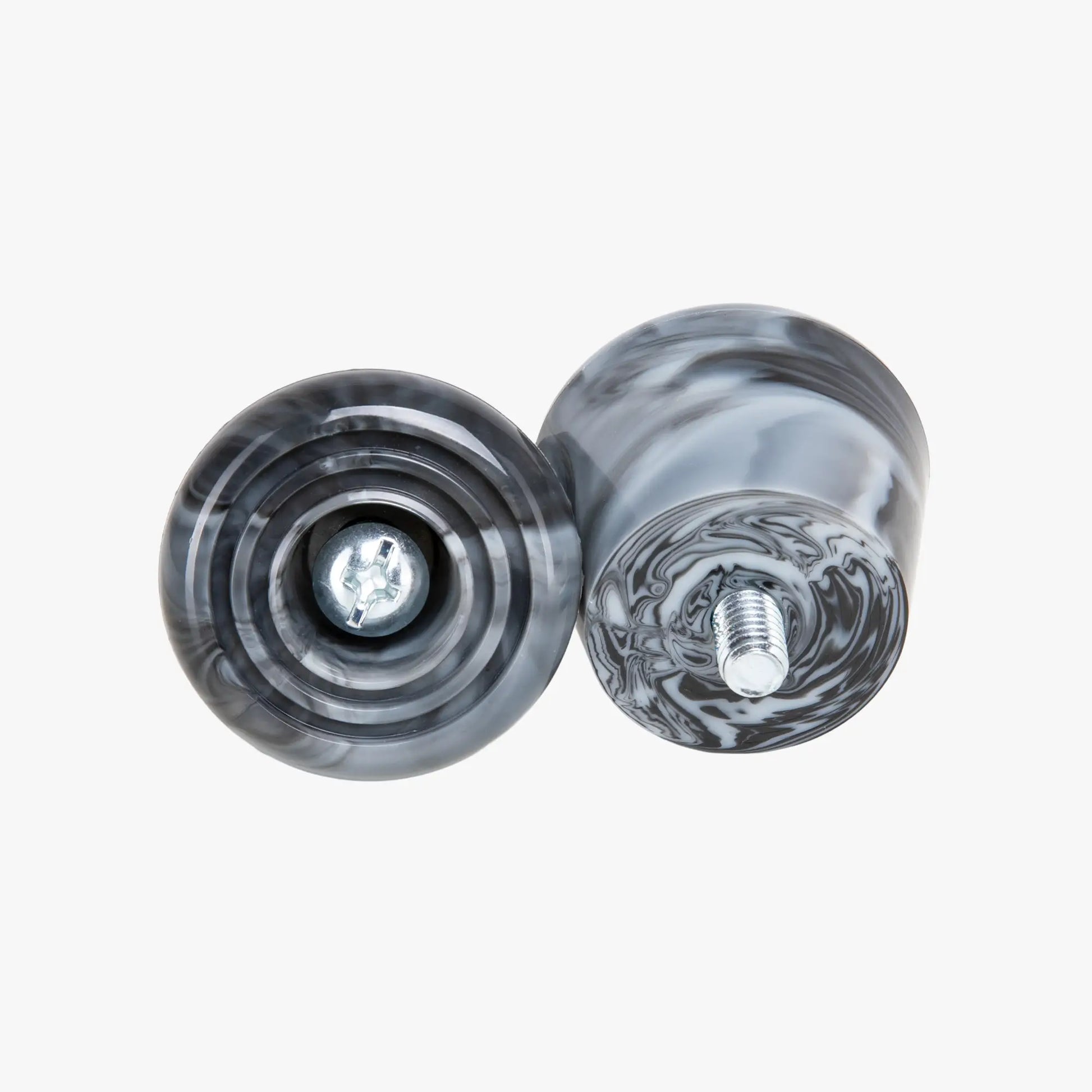 Two marble stoppers with a white background
