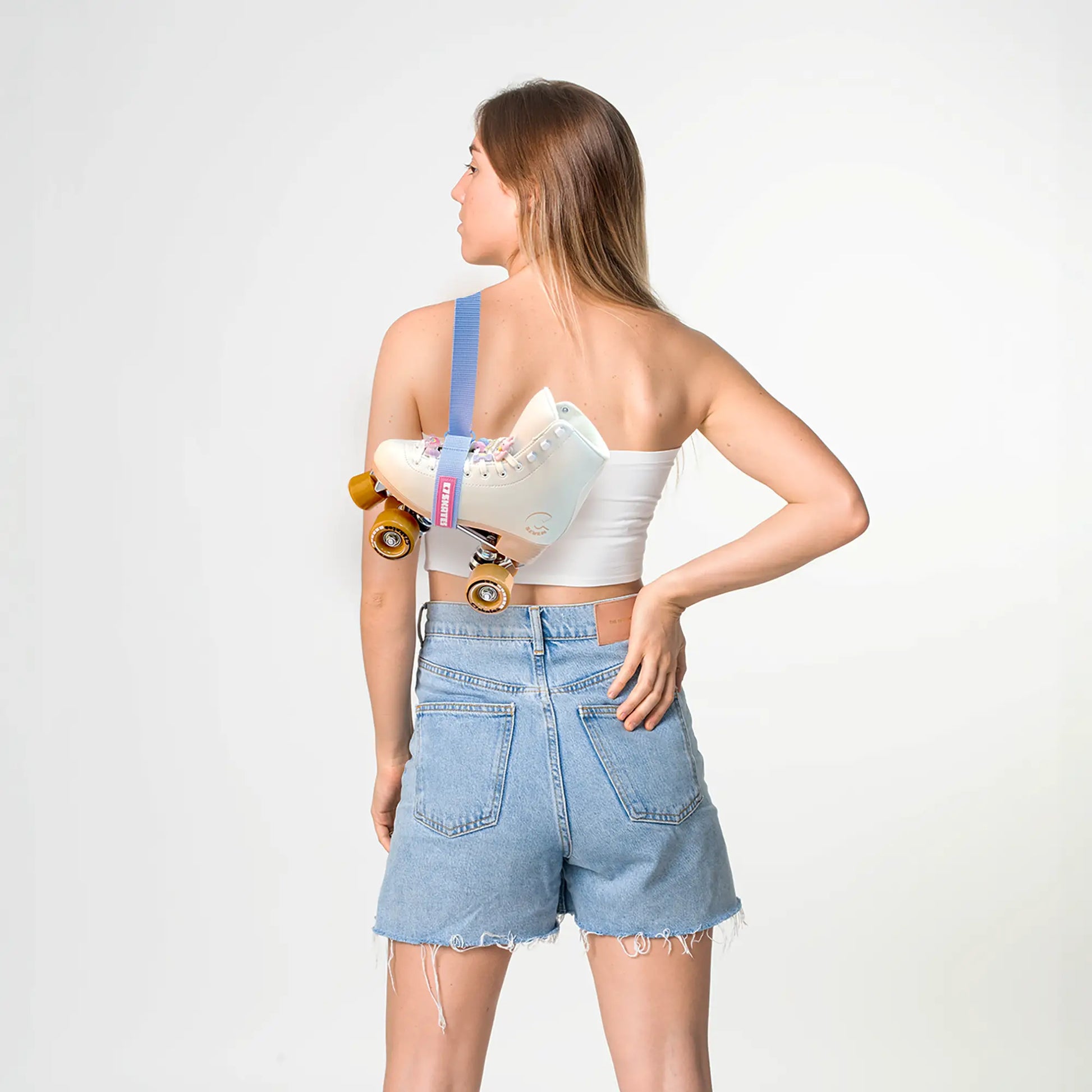 Woman holding a skate roller featuring the brand 'C7Skates' with a white background