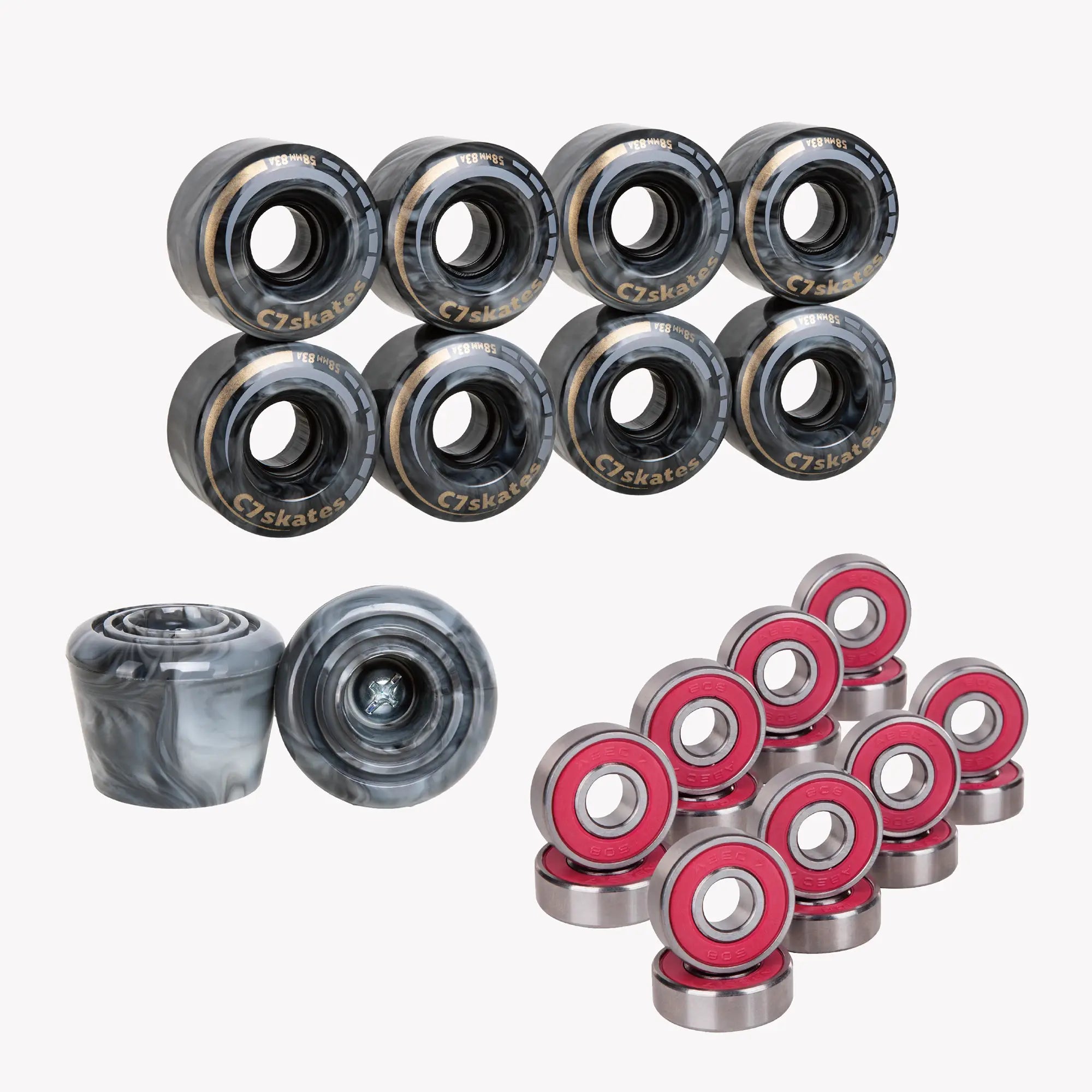 Collection of black-marble skates bearings and wheels on a white background