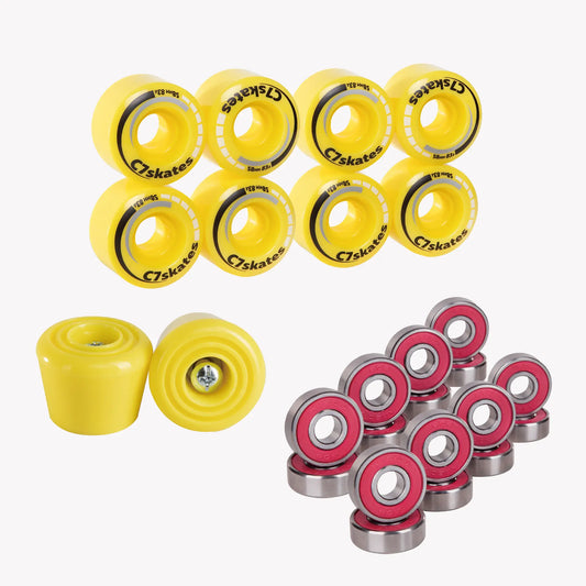 Yellow roller skate wheels and red bearings on a white background