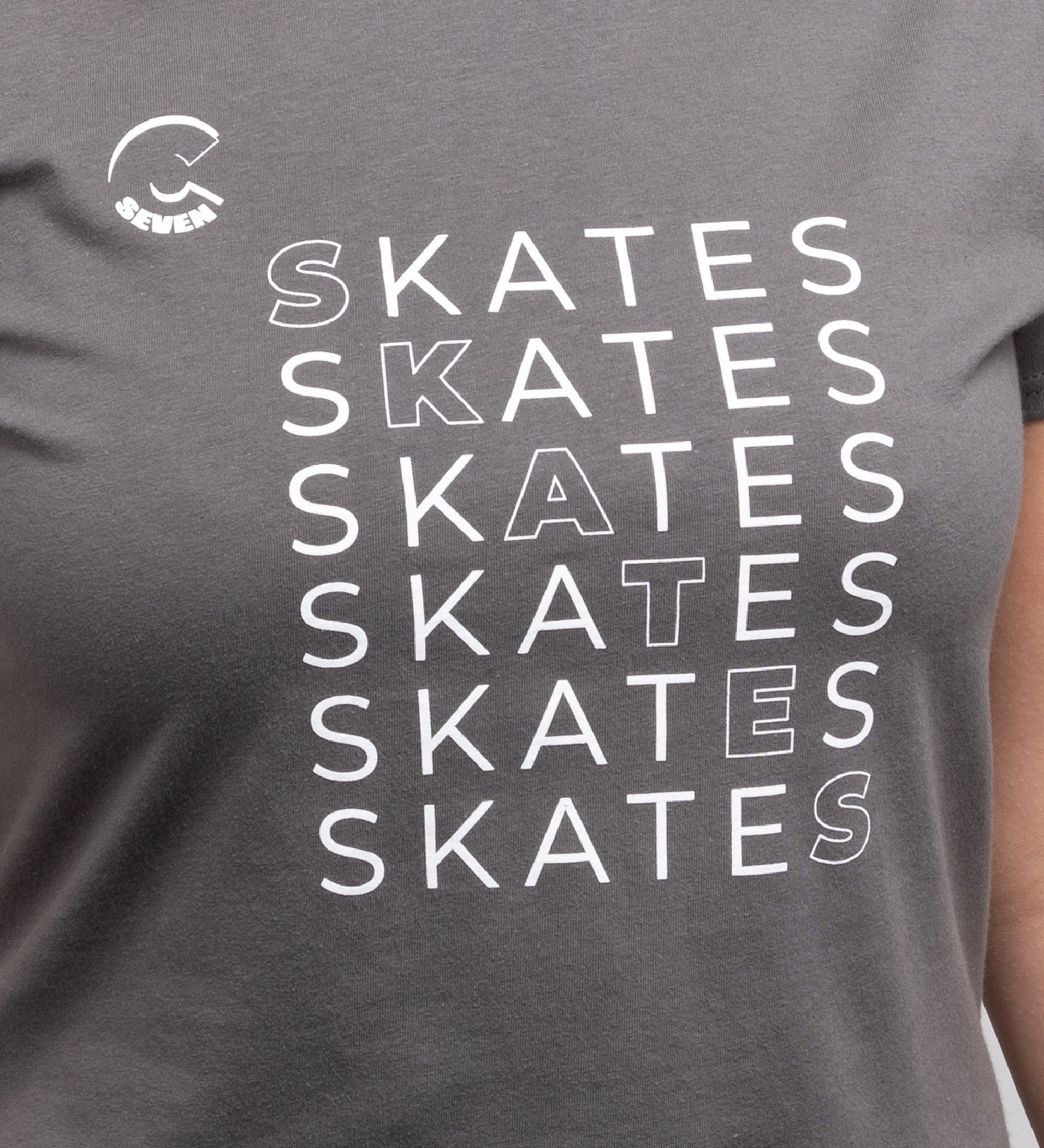 Gray t-shirt with 'SKATES' text repeated in white on a person wearing it.