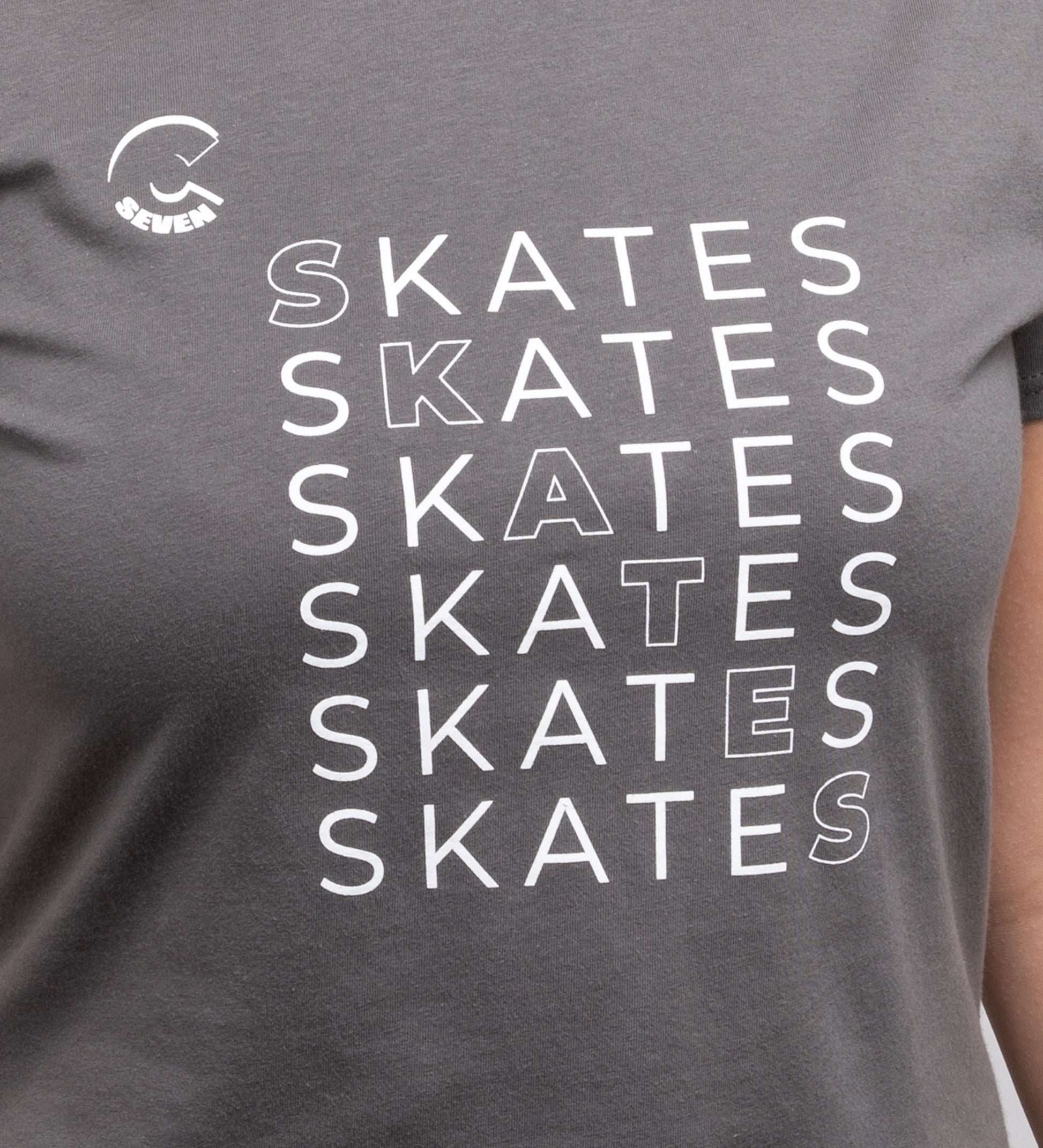Gray t-shirt with 'SKATES' text repeated in white on a person wearing it.