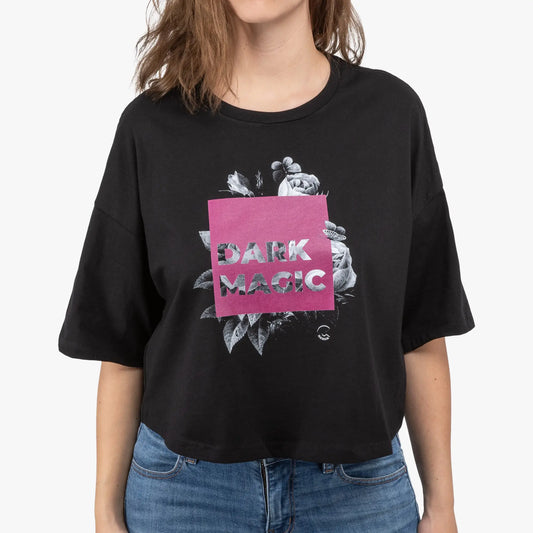 Person wearing a black t-shirt with 'Dark Magic' design on a white background